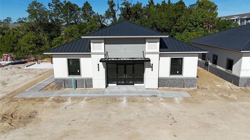 Under Construction. Building #04 is available for purchase at Palm Coast Town Center Exchange, a premier commercial development within Palm Coast’s Town Center master plan and part of a U.S. HUD opportunity zone. The zone boasts tax benefits for owners that participate in the program. The building is being delivered in dark gray shell condition offering a fully customizable interior, giving buyers complete flexibility to design their ideal layout. Strategically located just 0.3 miles in front of AdventHealth Palm Coast Hospital, off Interstate 95 and Highway 100, it boasts prime visibility and access along Town Center Boulevard with over 390 feet of frontage. Nestled in the thriving Town Center community, with multiple residential projects underway, this property is ideal for medical practices and businesses aiming to capitalize on one of Florida’s fastest-growing cities. Contact us for pricing, builder incentives, and to schedule a tour of this outstanding commercial opportunity.