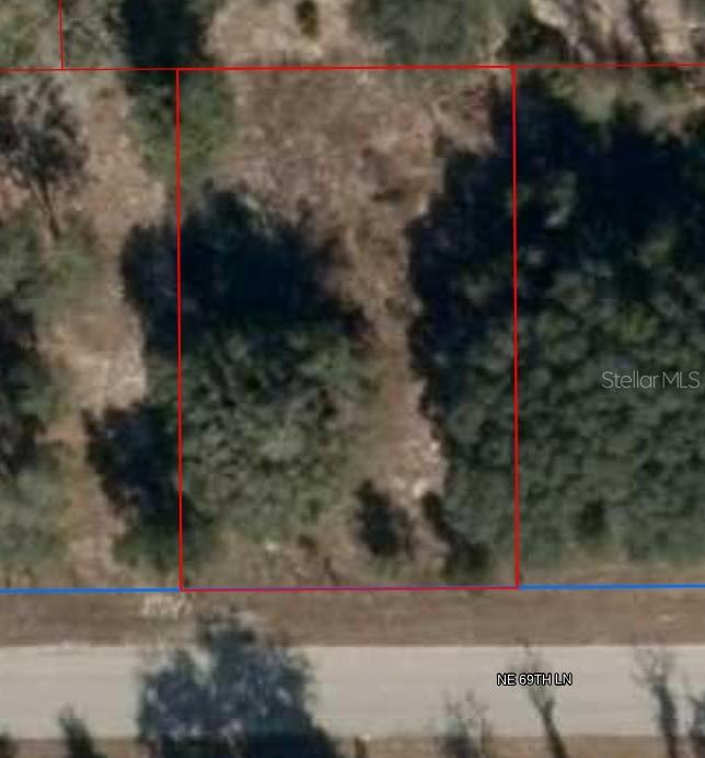Great lot close to HWY 27, on a paved road. Ready for new home or manufactured home.
