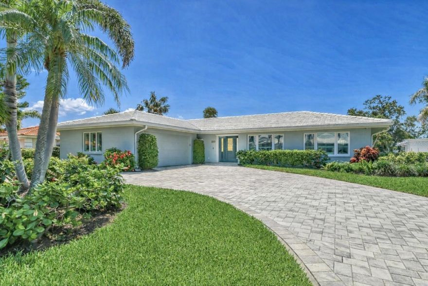 Welcome to your own piece of paradise in the prestigious Country Club Shores community on Longboat Key. This completely renovated 4-bedroom, 3-bath coastal retreat was taken down to the studs in 2012 and rebuilt with exceptional attention to detail—offering the rare combination of timeless style, modern infrastructure, and effortless move-in readiness on a tranquil canal.
From the ground up, every major system has been upgraded for peace of mind: new water and sewer lines, updated electrical throughout, impact-rated doors and windows, a resurfaced saltwater pool and with new pool heater. Newer seawall and dock, gas that was run to the house with no propane tank to worry about.  No component was overlooked. The result is a home that lives like new yet radiates refined coastal charm, with most of the beautifully curated furnishings remaining with the property. Inside, you’ll be welcomed by a bright, open-concept design featuring beautiful, engineered wood floors, custom beadboard ceilings, with beams, elevated ceiling heigh in the main living room and a soothing palette of sea-glass blues and clean whites. The heart of the home is a gourmet kitchen outfitted with stainless steel appliances, designer pendant lighting, and stylish lattice-front cabinetry. A large island anchors the space, perfect for entertaining, while the adjacent living area boasts custom-built-ins, a sleek gas fireplace, and expansive views that flow effortlessly outdoors. Each bedroom is designed for comfort and privacy, with spa-inspired bathrooms that feature elegant tile work, modern fixtures, and soft lighting. The primary suite is a retreat of its own, with custom shelving, cozy window seats, and lush garden views through plantation shutters.  Step outside to experience Florida living at its finest. The spacious screened lanai surrounds a sparkling heated saltwater pool and paved deck, creating a private oasis perfect for lounging, swimming, or dining alfresco in total comfort. Just beyond, a large, newer dock awaits, offering deep-water canal access—an ideal setup for avid boaters and water lovers. The deck overlooking the canal is a peaceful setting for morning coffee or an evening cocktail This home also offers exclusive deeded beach access, just a short walk or bike ride away, where you can soak in the soft white sands and turquoise waters of the Gulf. When it’s time to explore, the renowned boutiques and fine dining of St. Armands Circle are just down the street, offering vibrant nightlife, unique shopping, and gourmet experiences in a picturesque coastal setting. A short drive over the scenic Ringling Bridge takes you to downtown Sarasota, a cultural haven known for its art galleries, theaters, opera house, and waterfront dining. Whether you're strolling through the Saturday farmers market, taking in a performance at the Sarasota Opera, or enjoying waterfront cocktails at Marina Jack, the city provides an enriching blend of sophistication and coastal charm. With its ideal location, timeless design, and luxurious updates, this home offers the very best of Longboat Key living—a rare opportunity to enjoy both boating and beachside leisure in one of Florida’s most coveted communities.