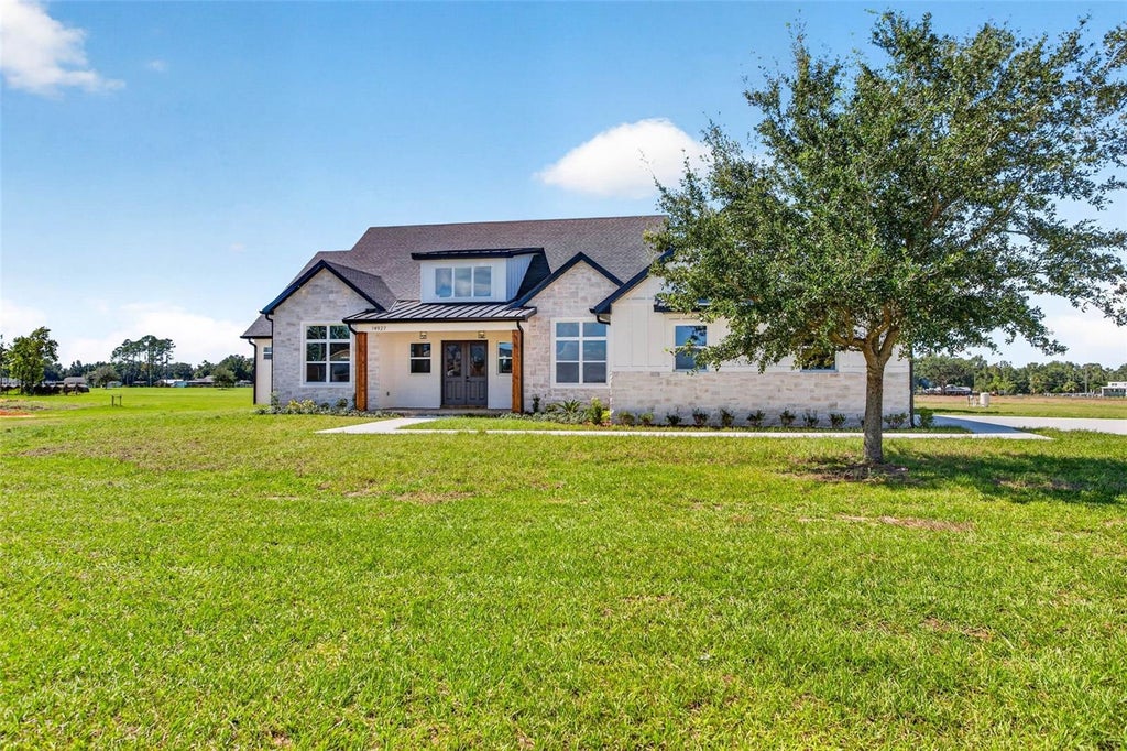Photo of 14927 Crimson Oaks Trl, Dade City, FL 33525 (MLS # TB8560688)