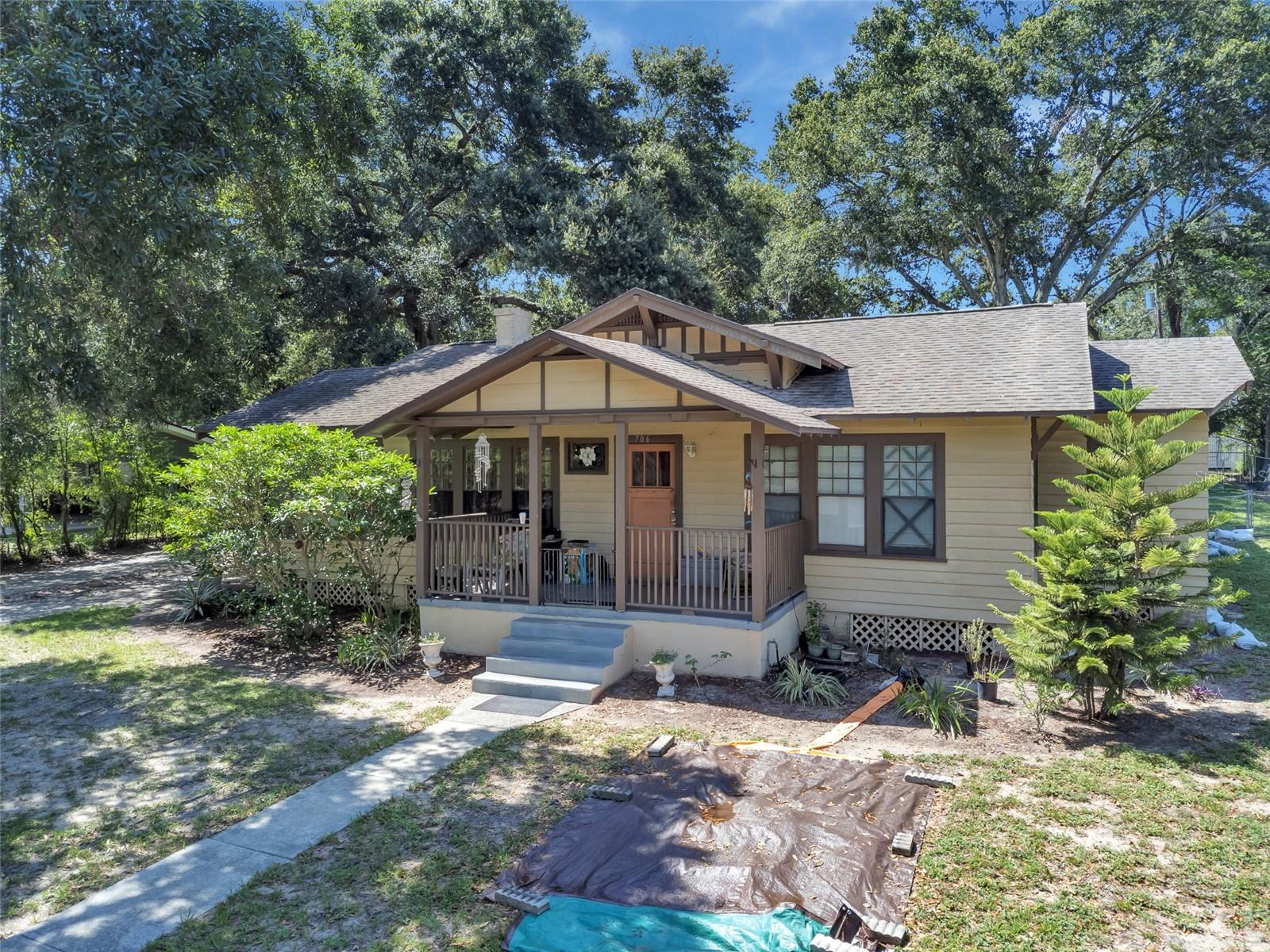 Discover timeless charm at this captivating 4-bedroom, 2-bathroom single-family home, built in 1918, offers a unique blend of historic character and modern convenience on a spacious 0.42-acre lot. Step inside to find detailed ceilings, large rooms, spacious living areas, and a cozy fireplace. The well-appointed kitchen with ample storage and counter space. Outside, the expansive yard provides plenty of room for outdoor activities and gardening. A valuable detached garage/workshop offers additional storage or hobby space. Located in a mature, desirable neighborhood in Lake Wales, this home provides a sense of community and easy access to local amenities, including the renowned Bok Tower Gardens and numerous recreational lakes. Don't miss this opportunity to own a piece of Lake Wales history! Priced to sell and ready to make your own.