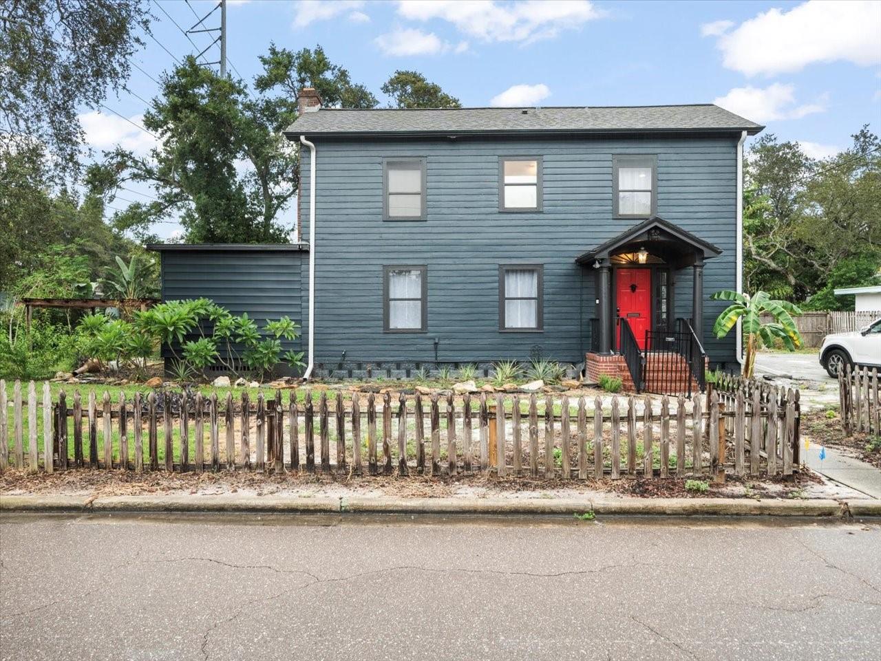 Currently zoned mixed/use and not a flood zone, This 3-bedroom 2-bath HISTORIC home was built in 1930 and offers so many possibilities! Situated on an oversized DOUBLE corner lot and in the heart of Clearwater-less then 10 minutes to Clearwater Beach, 30 minutes to Tampa airport.
Step inside to find inlaid chevron-pattern parquet flooring in the center hall along with a grand staircase, an old-school built in telephone seat and a spacious hall closet. The flooring flows into a living room area with a cozy fireplace and mantle with lots of natural light. There is a formal large dining room that showcases bay windows, a storage closet, and even has a vintage swinging door that leads into the brand-new kitchen! Here, you’ll love the updated plumbing, granite counters, shaker-style cabinets with soft-close doors, stainless appliances, and brand new ventilation. The laundry area has a new washer/dryer, a new 50-gallon water heater, updated plumbing, and a fully updated tile bathroom with shower and added ventilation.
The first guest bedroom is downstairs and has a new window and a new built-in closet. This is perfect for a playroom/office, Upstairs, the primary suite features its own wood burning fireplace and original hardwood floors. The second guest bedroom is oversized, also with original hardwood floors. A remodeled hall bathroom has a new glass shower, and it even has a filtered wand shower head! Classic details remain with the original linen closet and a floor-to-ceiling craftsman-style built-in closet just outside, along with a "cubby" for extra storage.
Updates include: new ceiling fans in each bedroom, new outlets and plates, fresh paint, privacy-tinted front door windows with an electronic lock, updated floor vents, new knobs and locks, newer downstairs A/C (1 years old). Outside, the deck has been freshly stained and sealed, with landscaping started.