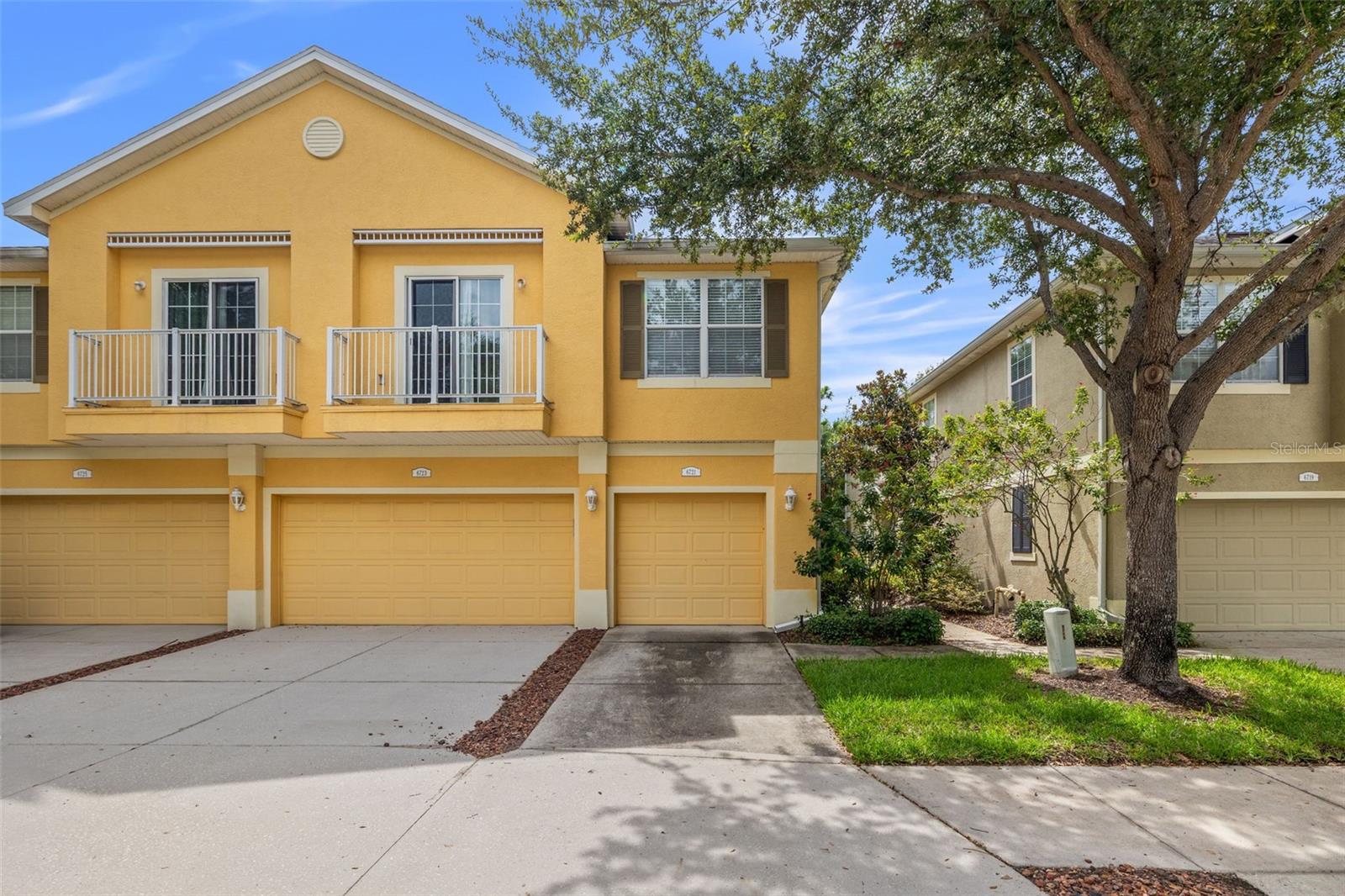 Welcome to this beautifully maintained townhome, perfectly situated in the heart of Riverview. Start your mornings with serene eastern-facing sunrises from your private balcony and enjoy abundant natural light throughout the day. Step inside to an inviting open-concept layout featuring elegant travertine floors that flow seamlessly through the spacious living and dining room combo, perfect for both entertaining and everyday living. The kitchen offers a cozy breakfast bar ideal for casual meals, along with ample storage space for all your culinary needs. This home includes 2 comfortable bedrooms and 2 full bathrooms, along with a one-car garage for added convenience. The gated community offers a refreshing pool, perfect for relaxing on warm Florida days. Conveniently located just under 10 minutes from local grocery stores and shopping, and only 15–20 minutes from downtown Tampa, you’ll love the easy access to everything you need!