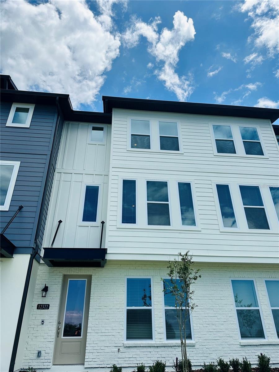 Spacious 3-Story Townhome with Water View in Laureate Park! This beautiful 3-story Townhome offers a functional and spacious layout. The first floor features an attached garage and a private bedroom with a full bathroom perfect for guests or a home office. On the second floor, enjoy an open concept living, dining, and kitchen area designed for entertaining, with large windows offering a serene water view from the living room. There is also direct access to a private balcony. The third floor includes a generous owner’s suite with a walk-in closet, dual vanities, and a walk-in shower, plus an additional bedroom with its own private bathroom. As a resident of Laureate Park, you'll enjoy access to top-tier amenities including a community fitness center and complimentary 1GB high-speed internet. Located just minutes from Medical City, Lake Nona Town Center, Johnson & Johnson, USTA, KPMG, Lake Nona Performance Center, and Orlando International Airport.