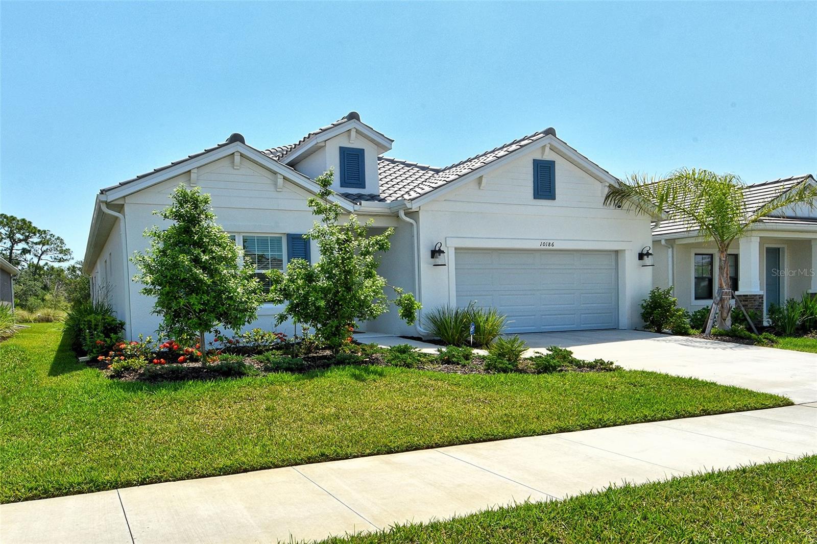 Why build when you can own this less than a year old Triumph model by Neil Builders in popular Grand Park. Architectural features abound as sellers have added $180,000 in custom upgrades. Over 3,000 sq. ft. under air with 4 bedrooms, office/den, bonus room & 4.5 baths. Main floor features 2 guest bedrooms (one is on suite with private bath), office & 3.5 baths. Second floor features a large bonus room, 18x17, plus generous bedroom & full bath. This home is situated on a very private preserve lot with a spacious backyard. Home features all impact doors & windows. Gourmet kitchen with custom cabinetry, quartz counters & upgraded stainless appliances. Natural gas features. Pre-wired for a private pool if desired. Modest fee includes ground maintenance & access to the resort style amenities including large clubhouse, fitness center, dog park, heated pool, playground, pickle ball & tennis. The builder has designed Grand Park with expansive open areas, lakes & preserves. You will love the peace & serenity of Grand Park. Close proximity to I-75, shopping & short distance to world famous Siesta Key Beach. Short term owner financing or lease purchase available.