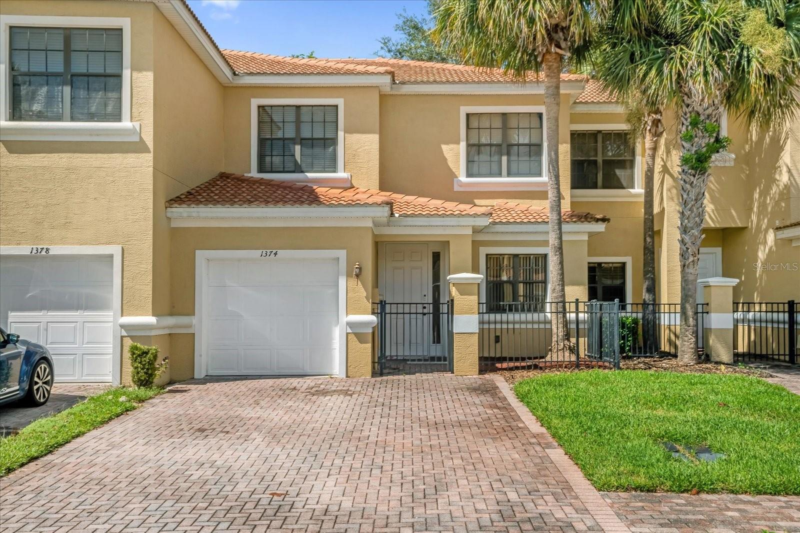 Welcome home! This charming two-story townhome with a one-car garage is move-in ready and waiting for its next owner. Upon pulling up you're greeted by the beautifully paved driveway offers plenty of parking, making it perfect for family and guests. Step inside to find inviting laminate flooring that sets a bright and modern tone. The kitchen features stainless steel appliances, floating shelves for style and functionality, and serves as the perfect blank canvas to add your personal touch. Upstairs, you’ll find three comfortable bedrooms. The spacious primary suite includes an en suite bathroom with dual sinks, a relaxing garden tub, and a separate shower—an ideal retreat at the end of the day. Enjoy the Florida lifestyle outdoors with a screened-in, pavered lanai—perfect for morning coffee or evening gatherings.
Located in a gated community, you’ll have access to exceptional amenities including a resort-style pool, fitness center, clubhouse, basketball and tennis courts. The HOA makes life even easier by covering lawn maintenance, cable, and internet, so you can spend more time enjoying your home. Schedule your showing today.