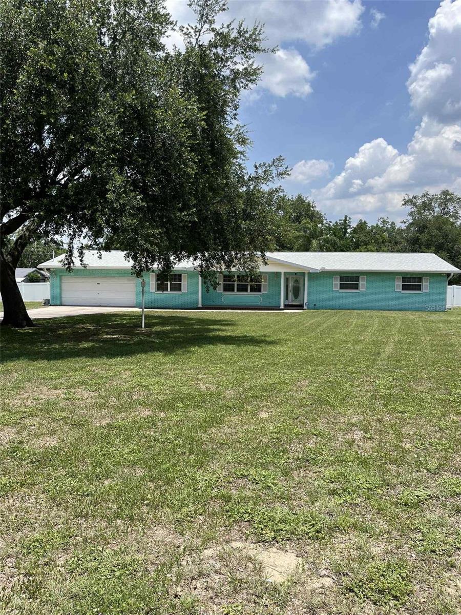 INCOMPARABLE HOME & PROPERTY! This 1.21-acre property and concrete block home is waiting for the next round of gatherings to begin. The home features combo kitchen and great room that keeps the conversations flowing while preparing delicious meals to serve at counter seating area, or in the formal dining room that connects to a formal sunk-in living room. There are 3 spacious bedrooms and 2 bathrooms. Bathroom 1 features double sinks, tub shower combo; master bath has shower stall and separate vanity area. There are 3 bonus rooms including a home office with built in closet, a bar-lounge/music room, and Sun room with skylights and floor to ceiling windows overlooking the 13’ X 34’ sq ft foot lanai. Enjoy countless hours relaxing in the fully screened lanai overlooking 16’X 32’ sq ft marcite pool surrounded by mature palm trees. Perform exercise laps or float in the cool water under the beautiful Florida sunshine. Ample parking for an RV and a boat. NO HOA! Flood Zone X – flood insurance not required. Additionally, the property features 2 utility sheds and a separate concrete/stucco building that includes a full bathroom with shower. This structure can be updated as income-producing rental, in-law home or workshop. BBQ lovers can showcase their skills on the custom-built 4’x 5’ sq ft wood-burning grill under a covered patio; which allows cooking rain or shine. The backyard is secured with vinyl-privacy and chain link fencing. Updates to the home: roof 2025, LVF in bedrooms, office and Sun room 2024, washer/dryer 2023, re-pipe 2022, HWH 2022, AC 2021, well pump 2021, bladder tank 2020, drain lines 2019, fridge 2019. Laminate in LR/DR and ceramic tile throughout. Beverage fridge on lanai and all other appliances conveys AS IS. Double pane windows. ADT Security system. Most furniture in the home is available to convey. Pool equipment conveys. Location is convenient commute to Brandon Town Center, Downtown Tampa & Channelside TIA, MacDill AFB Clearwater Beach, Disney World. Shopping center with Publix, restaurants, LA Fitness. Bloomingdale HS pyramid. Property is sold AS IS.