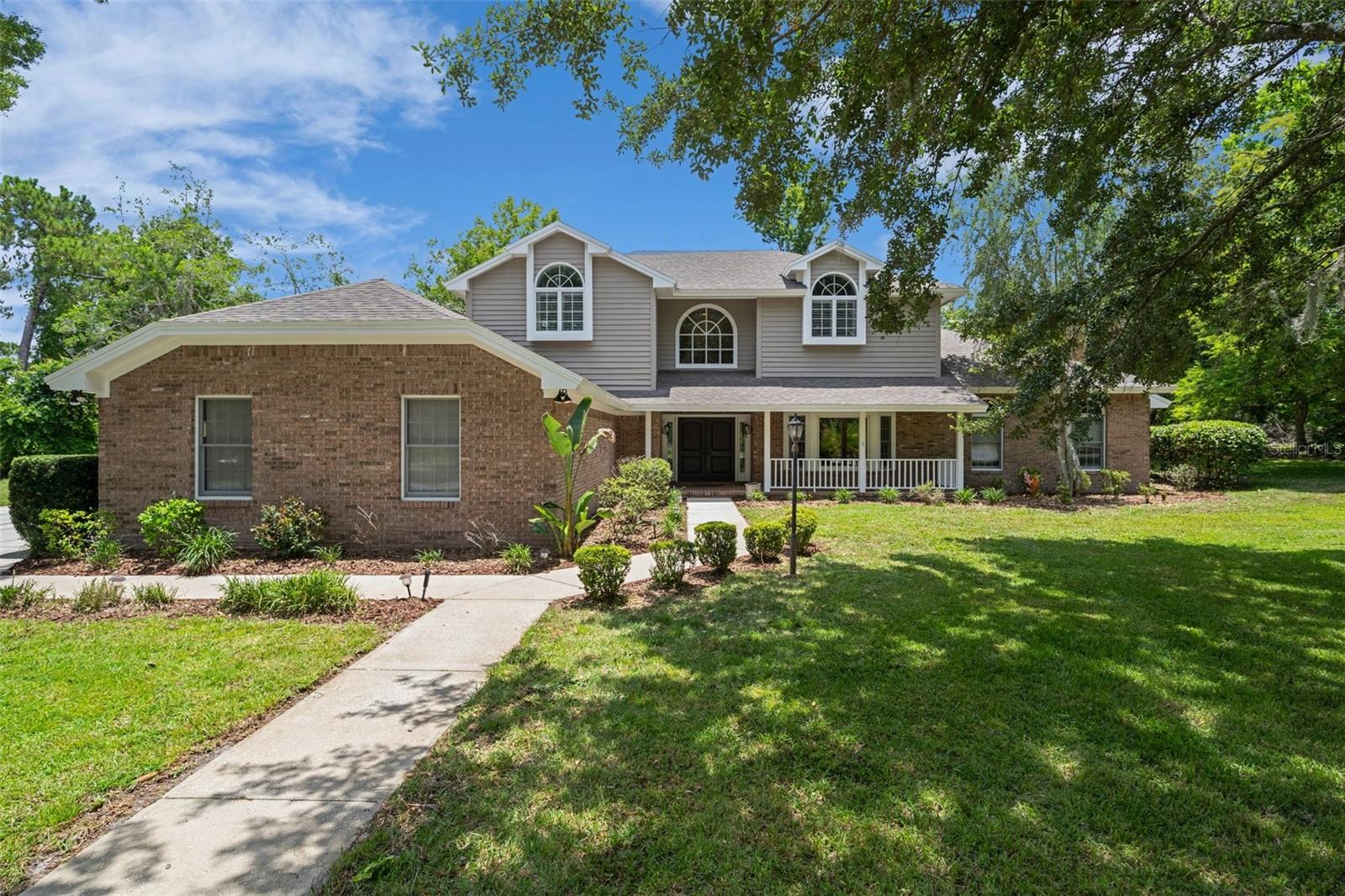 Discover a rare blend of luxury, privacy, and natural beauty in The Waters of Weeki Wachee, a sought-after gated riverfront community with 24/7 staffed security, tennis and basketball courts, mature oak-lined streets, and direct access to the enchanting Weeki Wachee River. Situated on an expansive 0.82-acre corner lot, this immaculate 4-bedroom, 3.5-bathroom two-story pool home with koi pond is a true retreat—offering nearly 3,700 sq. ft. of upgraded living space and refined character throughout.
Step inside to find a welcoming 14x10 entry foyer with storage closet, elegant crown molding, and 5.25” baseboards throughout the main level. A formal living room (16x14) with transom windows, French doors, and a custom faux-painted ceiling sets the tone, while the oversized dining room (18x15) features a bay window and chair rail accents, ideal for hosting. The 21x19 family room includes floor outlets, a rustic wet bar, and a wood-burning fireplace with wood-accent mantle—perfect for cozy evenings or entertaining.
The gourmet kitchen (16x11) is a chef’s dream with granite countertops, butcher block breakfast bar, stainless steel appliances including a 6-burner stove with grill, custom cabinetry with lazy Susan and spice rack, indirect lighting, and a stunning brass farm sink. A separate 11x13 breakfast nook offers floor-to-ceiling windows, a built-in bar, and views of the koi pond with dual waterfalls.
Enjoy the Florida lifestyle year-round in the 48x22 screened pool enclosure, featuring a Diamond Brite electric-heated chlorine pool (32x16), paver decking, and an above-ground heated spa. A 48x13 glass-enclosed rear lanai offers additional living space with dual split A/C units, ceramic tile flooring, and fresh paint. A convenient half bath and full pool bath with vessel sink and floor-to-ceiling tiled shower add function and flair.
The home’s exterior boasts cedar siding, sidewalks, mature landscaping, and motion-sensor flood lights. The backyard is a private oasis with shaded oak trees, koi pond, dog door off the pool cage, and a peaceful wooded swing facing the community fountain.
Upstairs, the primary suite (17x15) includes a walk-in closet (12x11), additional built-in storage, and an en-suite bathroom with jetted garden tub, floor-to-ceiling mosaic tile shower, dual vanities with stone countertops, upgraded cabinetry, bidet-style toilet, and space for a TV above the tub. Bedroom 2 (14x11) connects to the guest bath and offers a walk-in closet. Bedroom 3 features a built-in entertainment center and ample closet space. Bedroom 4 is located on the main floor and includes built-in desk space and sliders to the lanai—ideal for guests or a home office.
Additional highlights include a 15x18 laundry room with cabinetry and utility sink, dual-zoned HVAC, hot water recovery system, programmable thermostats, irrigation well, county water/sewer, exterior generator hook-up, and a 2-car garage with interlocking workshop flooring, wall slot organizers, and abundant storage.
This home offers timeless elegance, unmatched functionality, and rare access to one of Florida’s most scenic rivers. Don’t miss your chance to own this one-of-a-kind property in one of Hernando County’s most stunning communities.
Call today to schedule your private showing and experience the ultimate blend of comfort, luxury, and nature—this dream home won’t last long!