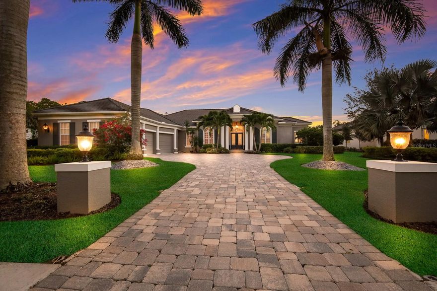 This custom John Cannon build estate home is located on a quiet private cul-de-sac and showcases unparalleled craftsmanship and attention to detail. The kitchen is a chef's dream with a walk-in pantry, new oversize quartz island, granite counters, tiled backsplash, upper and lower cabinet lighting, top-of-the-line WOLF appliances, including a 5-gas burner cooktop and wall oven. The Sub-Zero refrigerator and wine closet add to the culinary appeal.
Throughout the main living area of the home, you'll find new 23.5" tiled flooring, creating a seamless and elegant aesthetic. The great room is a focal point, featuring a gas fireplace with a striking tiled accent wall extending to the ceiling, high ceilings, Crown molding and French Doors.
The property boasts two guest bedrooms, each with walk-in closets and full En-suite baths. One guest bedroom has been tastefully remodeled, showcasing new engineered wood flooring, new bath with walk in shower and custom closet space. The den, located near the convenient half bath, is complete with engineered wood flooring, offers a versatile space for work, play or relaxation.   The office offers built in shelving, engineered wood flooring, French doors and plantation shutters. Upon entering the owner's suite, it is a true retreat, featuring a tiled shower that extends to the ceiling, a luxurious jetted tub, dual vanities with a makeup counter, and two large walk-in closets with custom built ins.  An impact door provides convenient access to the outdoor living area.
Beyond the interiors, the three-car garage, paver driveway, and impact windows and doors provide convenience, and peace of mind. The outdoor space is a haven with a large under-cover lanai overlooking the lake, an outdoor kitchen with a gas grill and tiled backsplash, and a saltwater heated pool, perfect for entertaining and enjoying peaceful moments.
Situated in The Concession Golf Club, this home is part of a private gated community surrounded by 1200 acres of 200-year-old oaks, preserves, protected wetlands, and lakes. The proximity to renowned beaches like Lido Key, Siesta Key, and Anna Maria Island, along with shopping destinations like UTC Mall and Waterside Place, and easy access to downtown Sarasota, Tampa, and Sarasota Airports makes this property a unique blend of luxury and convenience. It's not just a home; it's a lifestyle, complemented by the rich history of The Concession Golf Club where golf legends Tony Jacklin and Jack Nicklaus became forever linked by the memorable 1969 Ryder Cup, where Nicklaus graciously conceded a short putt to Jacklin, resulting in a historic match.  The PGA World Champions Cup is set to make its debut at Concession December 7-10, 2023. Room Feature: Linen Closet In Bath (Bedroom 2). Bedroom Closet Type: Walk-in Closet (Primary Bedroom).