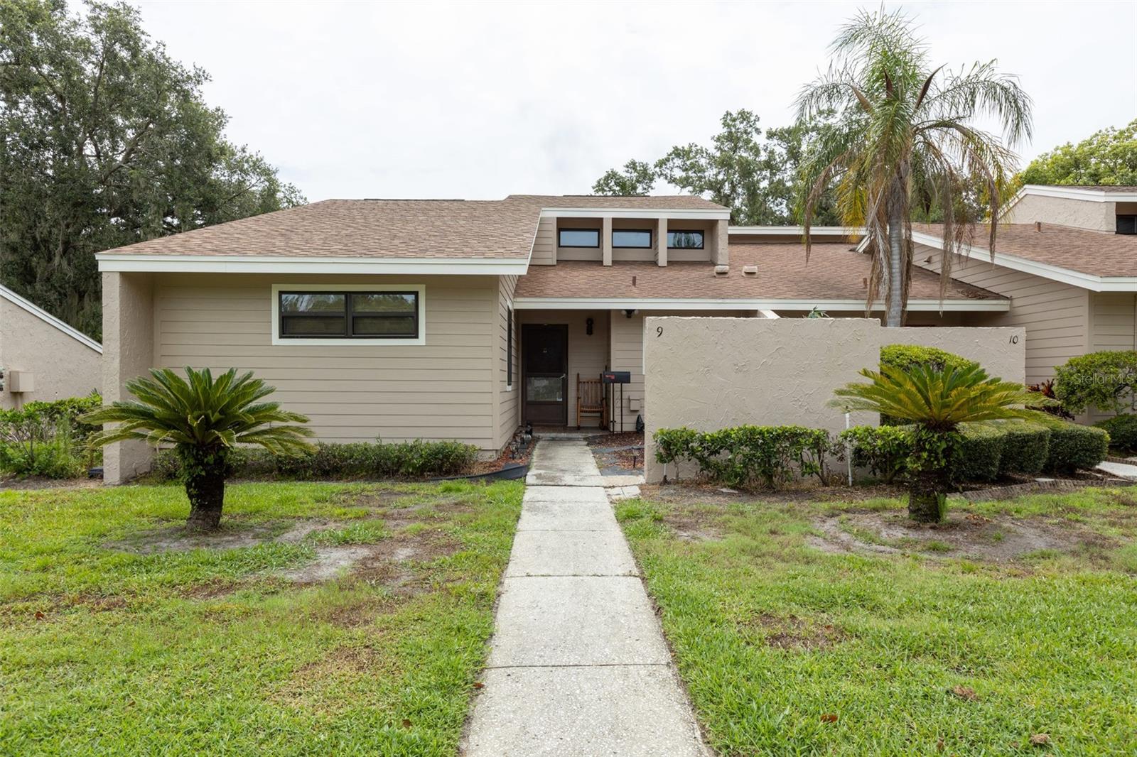 Looking for effortless Florida living? Well look no further because this charming 3 bedroom 2 bathroom END UNIT condo nestled in the sought-after Double Eagle Community provides the comfort low maintenance living that you've been looking for. As soon as you walk in, you will be welcomed by high ceilings and natural wood beams that give an inviting atmosphere that is filled with natural light from the skylights found above the living room dining room combo. The kitchen gives abundant cabinet space, essential appliances and the ability to have easy meal service with its convenient pass-through window into the dining area. For added convenience, a wet bar can be found in the dining area for all your cocktail or mocktail needs. Found through the sliding glass doors off the living room, is your own private expansive lanai offering a serene and peaceful view, a perfect added space for relaxing or entertaining. The master suite provides a large walk-in closet and ensuite bath, making it a perfect retreat for any homeowner. 2 more bedrooms, 1 bath, and a laundry closet make up the rest of this adorable condo and will surely provide for any needs. Some added bonuses to this property include the roof being recently updated, new windows have been put on throughout the home, and new siding and paint have been completed on the outside. The location of this condo just adds to its appeal. Conveniently located between Mulberry and South Lakeland, you'll find you are close to shopping, restaurants, entertainment, as well as easy access to the Polk Parkway which provides quick routes to Tampa and Orlando. First-time homebuyers, downsizers, or investors don't let this opportunity pass you by. Come see what owning this condo can do for you.