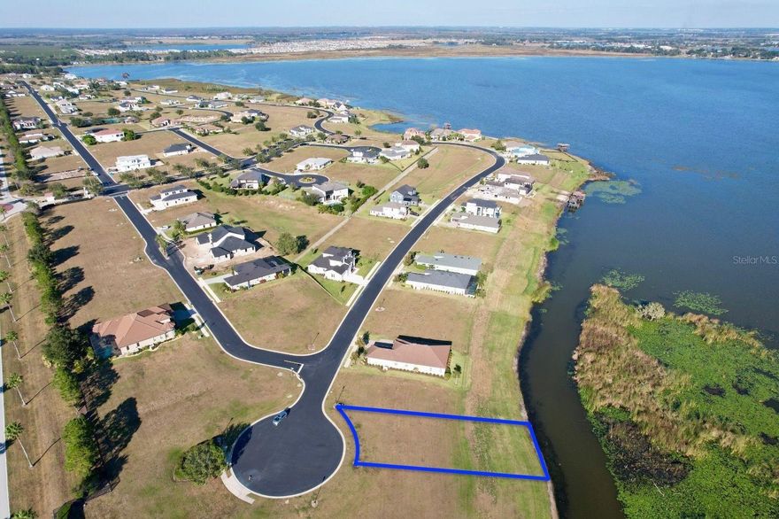 This is a very beautiful lot located within the Water Ridge community, with Lake Alfred front, and ready to build the house of your dreams with an awesome view.
https://www.waterridge.com. Water Ridge is a private gated community , known for its luxurious amenities, three swimming pools , fitness center, clubhouse, tennis courts, boat ramps, and a gazebo with a grill, as well as boat and RV storage facilities, pickleball courts and a clubhouse.