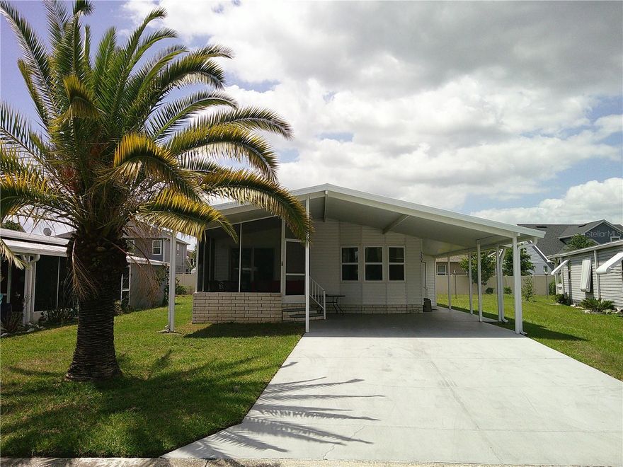 Welcome to Timber Lake Estates! An all aged Gated Community! This cozy 2 Bedroom 2 Bathroom home is waiting for you. It features an open kitchen, Updated windows and double car port. The front screened in porch is great for morning coffee.  This home is in a great location with easy access to Wesley Chapel and Zephyrhills. All this and located in a very desirable all aged well kept family oriented community with tons of activities and great amenities some of which include 2 pools, 2 clubhouses, Shuffleboard and Basketball courts, fishing lake with dock and YOU OWN THE LAND.