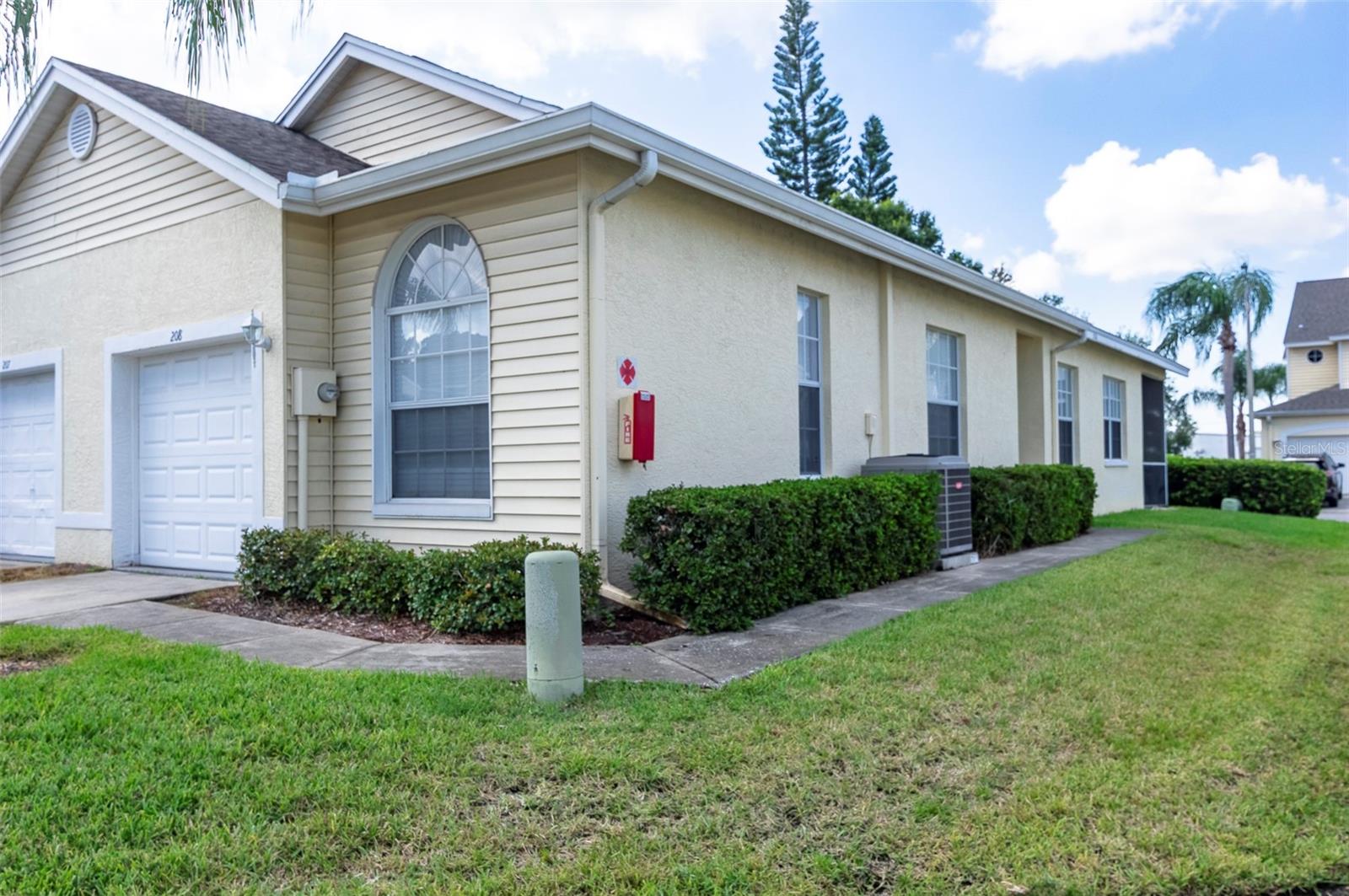 Location! Location! This beautifully updated 3 bed 2 bath corner lot villa is in the Willow Greens Community and centrally located to shopping, restaurants, parks, a public golf course and the beaches and has easy access to highways and 2 airports. Updates in 2020 include the kitchen, bath vanities, AC, hot water heater, 5 new ceiling fans and hard wired smoke detectors, electric garage door opener and a surge protector was added to the breaker box. The Kitchen updates include soft close cabinets, quartz countertops, marble backsplash and new appliances. In 2021 hurricane brackets were added to the home. In 2022 there was a tile floor installed on the screened lanai and the master bath shower was updated. There is a 1 car garage and the driveway has room for 3 cars. This home is move in ready! The HOA covers lawn care, road maintenance, pool cleaning and maintenance, exterior pressure washing, painting, window and screen repair/replacement and roof replacement. It also includes water, sewer and garbage as well as cable and internet. Come see today so you can start living the Carefree Florida lifestyle!