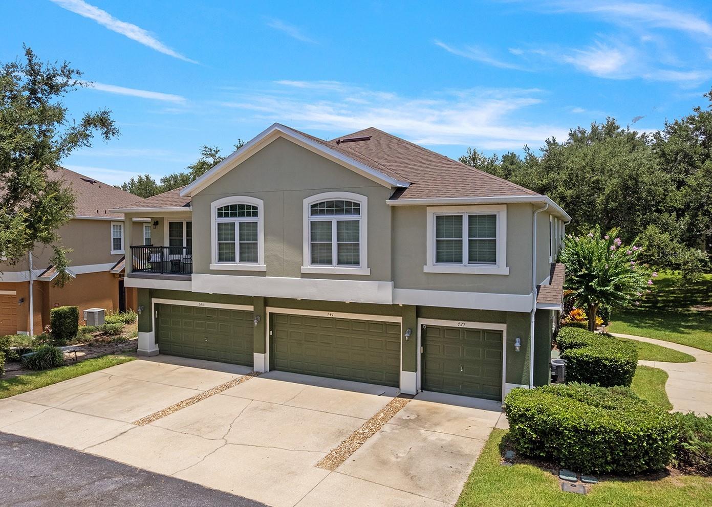 Welcome to this beautiful 3 bedroom/2.5 bath end unit in The Overlooks at Parkside. The name says it all! This unit is located on the back of the building with a NEW $16k screened lanai (2023) overlooking the community park and walking path that leads to the community pool. The condo features a NEW ROOF (2025) and an oversized 2+ car garage with extra space for storage. ** Upon entering the unit, you’re immediately greeted by upgraded porcelain tile on the first floor, 5” baseboards, and neutral paint throughout. ** The kitchen features 42" cabinets, stainless appliances, granite counter tops, and a breakfast bar. The kitchen flows onto the open dining area and family room with tons of space for the whole family. The NEW screened lanai is easily accessed through the sliding glass doors to relax and enjoy the views. ** This unit offers tons of storage! The 2 car garage was designed with an extended section. Next, Laundry is conveniently located on the first floor. Washer and Dryer INCLUDED! Lastly, there is a built in storage closet with shelves under the stairs that could also be used as a 2nd pantry! ** Upstairs you'll find updated carpet, 3 bedrooms and 2 full baths. The master bedroom boasts tall ceilings, 3 bright windows, an upgraded en suite bath with double sinks, granite counter tops, a large RETILED walk-in shower with NEW barn-style glass doors (2024), and a full linen closet. The upstairs also has two additional bedrooms, 2 linen closets, and a guest bathroom with double sinks, granite counter tops, and neutral shower tile. ** Other major components of the home include a newer hot water heater (2021) and a well maintained AC (2016). Community features include a pool, exterior maintenance, and exterior pest control, and internet cable.** If you're looking for a carefree, low-maintenance place with tons of character, this is it! Conveniently located near schools and a short drive to nearby shopping, the 429, and Orlando. Make your appointment today!