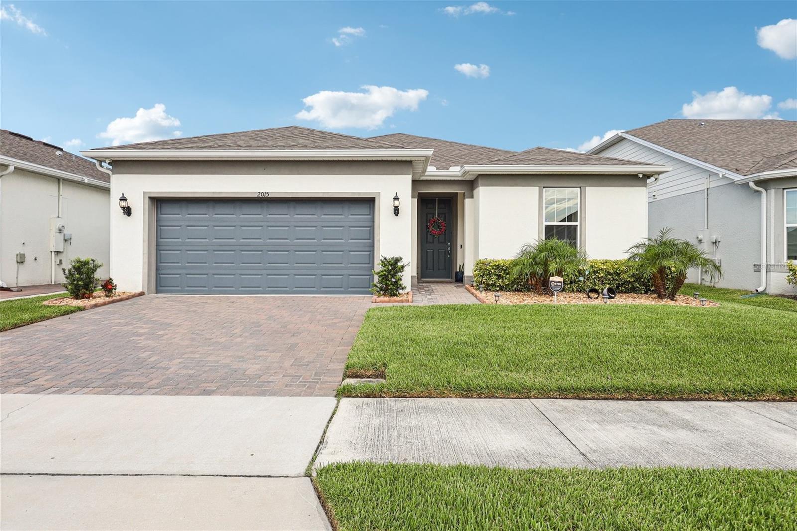Great opportunity and price for this immaculately maintained home inside the GATED Tohoqua Reserve. This split floor plan 3/2 with a den / flex space which can be easily converted to a 4th bedroom, office, or living area, features luxurious details such as neutral ceramic tile floors throughout the entire home, kitchen with oversized island, 42" cabinets with crown moulding, granite countertops and stainless steel appliances, overlooking the living and dining room, for an open concept designed for entertaining, which flows seamlessly into a covered screened-in extended patio, facing a large backyard with no rear neighbors for added privacy and enjoying nature. The primary bedroom is located in the back of the home, providing a tranquil retreat which includes an en-suite bathroom featuring a fully tiled super-shower with a bench, double vanity, huge walk-in closet and quartz countertops. The remaining bedrooms are spacious and comfortable for your guests or occupants alike, and the secondary bathroom has a tub perfect for soaking and relaxing. The home is rounded off by a convenient inside laundry room with a washer and dryer, a 2 car garage with extra mounted storage space, and paved driveway for additional vehicles. The community features private amenities like a Clubhouse with Fitness Center, resort-style pool and outdoor fire pit, pickleball and bocce ball courts, dog park and more – exclusively reserved for those 55 and older. Residents also have access to Tohoqua's amenities outside the reserve, including another resort style pool for younger guests, and there are more than 5 miles of trails winding throughout the community for walking, running and bicycling to enjoy the Florida Lifestyle. The Tohoqua trails connect to trails outside the community, including the Twin Oaks Conservation Area trail that takes you to the shores of Lake Tohopekaliga. For those who prefer to paddle, you can launch a canoe or kayak into the Saint Cloud Canal and go north to East Lake Tohopekaliga or south to Lake Tohopekaliga. Restaurants, shopping centers, medical facilities and major roads like the Turnpike and 192 are minutes away, and less than an hour from the East Coast beaches and theme parks. Come see this home today!