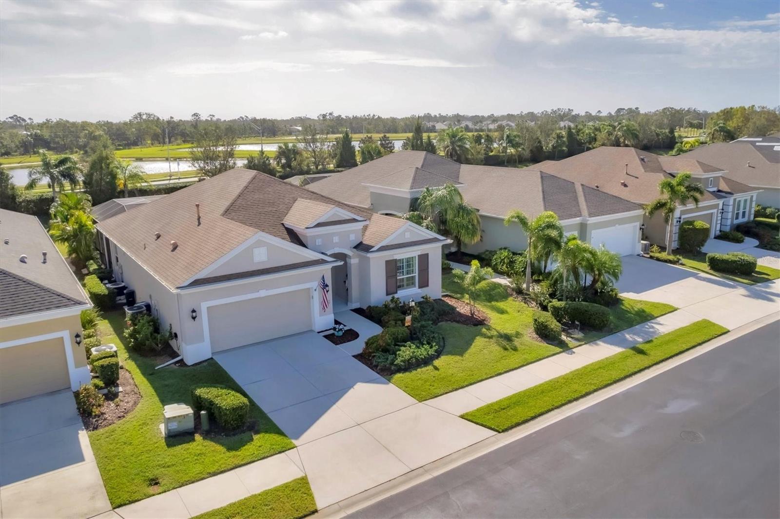 Welcome to the gated, maintenance-free community of Eagle Trace. This three bedroom, two bathroom pool home features a den, open floor plan and 10 foot ceilings framed by crown molding. The open floor plan from the kitchen to the dining area and living room creates the perfect layout for entertaining and family gatherings. The kitchen boasts quartz countertops, stainless steel appliances, a gas stove, a breakfast area, large pantry and cabinets with pull out drawers. The triple pocketing sliding doors in the family room open to your extended paver patio and heated, salt water pool as well as your large private backyard. The flex room located off the family room can be used as a home office, den or, with the addition of a closet, a fourth bedroom. The primary bedroom is a private and relaxing retreat with coffered ceilings, two large closets with custom built ins, and an en-suite bath making it the perfect place relax at the end of the day. The primary bathroom offers a zero entry shower, dual sinks and soaking tub. Two other bedrooms are located toward the front of the home on opposite sides of the hallway with a guest bath located conveniently between. No carpet – tile and Luxury Vinyl throughout, an indoor laundry room, extended insulated garage, radiant barrier, smart house lighting, gas plumbed area on patio for outdoor kitchen and extra attic space for storage are some of the many additional upgrades. This home also has over three years remaining on the structural and AC warranties. The community amenities include tennis/pickle ball courts, resort-style community pool and hot tub with covered sitting and grill area for gatherings, two dog parks and a playground. Located in an A rated school district and close to all the conveniences of Lakewood Ranch with no CDD fees this home is the perfect place to call home!