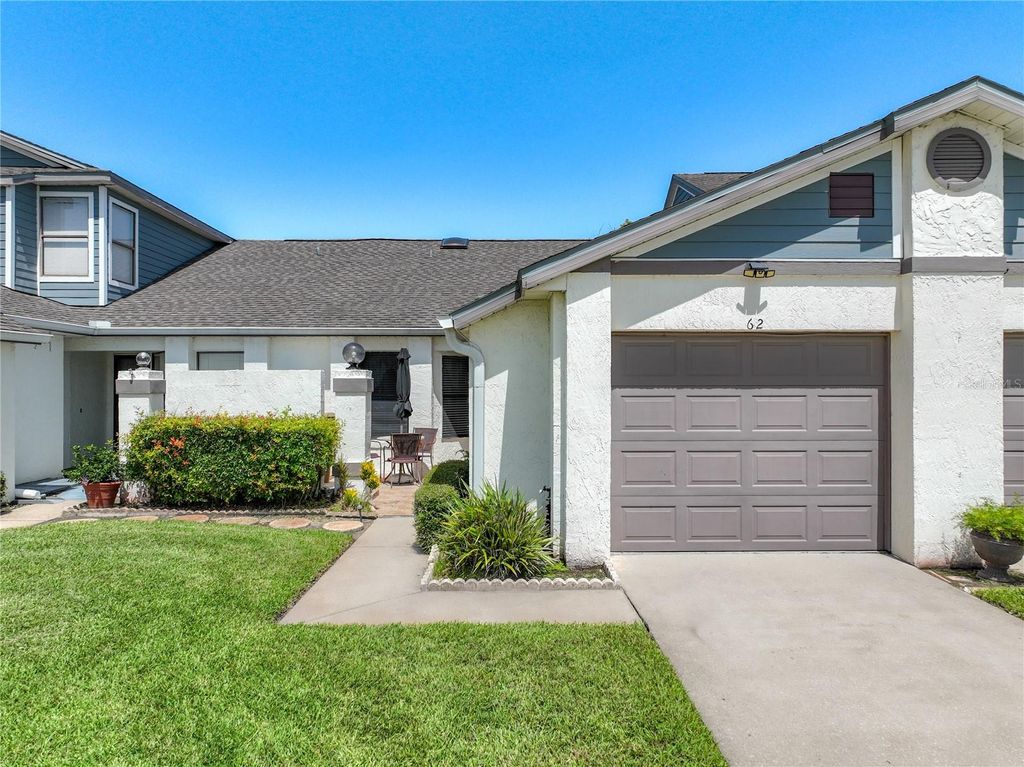 Photo of 62 Lakepointe Circle, Kissimmee, FL 34743 (MLS # O6423673)