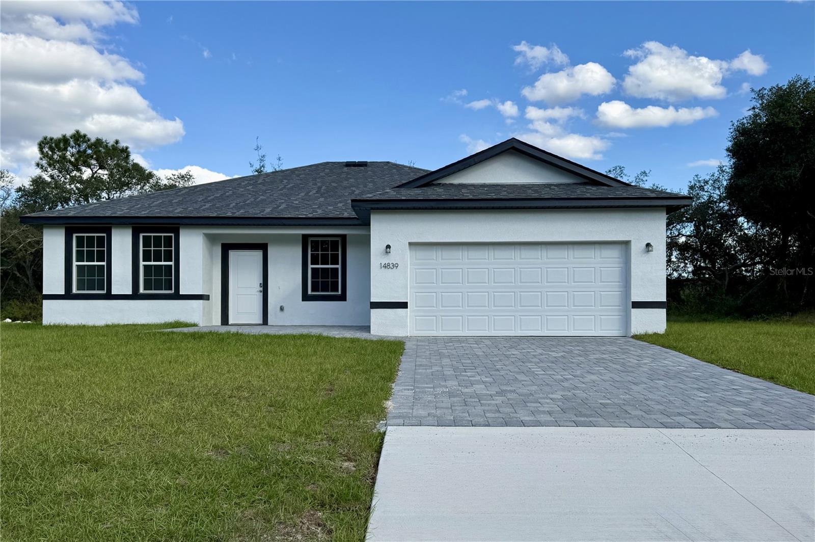 Bring the family to this Brand New 4 bedroom/3 bath Home in Marion Oaks with NO HOA! High & dry. No Flood Zone. If you can't find a Mother-in-law suite, Here's the next best- AN ENSUITE W/ ITS OWN BATH & HUGH WALK IN CLOSET. Great for a home office! This Open Floor Plan offers a Covered FRONT Porch and Covered Lanai off the kitchen.  Tall ceilings throughout ARE 9”4”. Tile throughout! No carpet! Builder Warranty. Ask about a FHA a 4.99 PERCENT INTEREST RATE , 30 year fixed rate OR Lender Paid Closing Costs. Call agent for further details.  This home is eligible USDA, VA, FHA!. No back neighbors ever-county owned property behind!  PAVER BRICK PATIO & DRIVEWAY.
New Elementary school is complete and New High School 2026. Close to Shopping, Medical, I75 to Orlando, Restaurants & More... Marion Oaks amenities include a community center with a library, auditorium, and recreational facilities like a splash pad, fitness center, and sports courts for basketball, tennis, pickleball, and volleyball. Outdoor amenities feature parks, playgrounds, and walking/biking trails, and the community also provides convenient access to shopping and dining, with nature areas like the Cross Florida Greenway nearby. SCHEDULE YOUR TOUR TODAY!