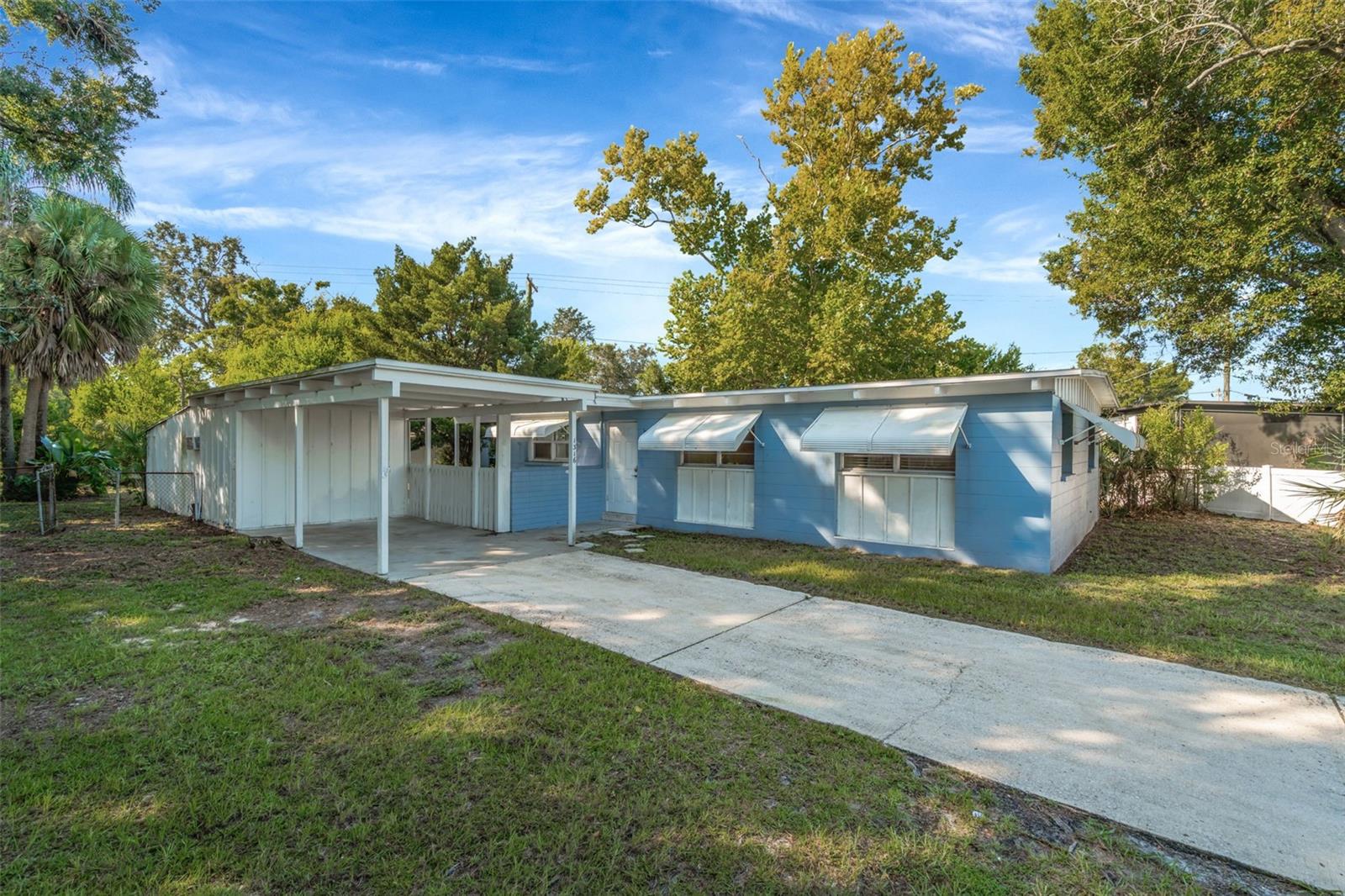 This lovely Tampa gem has the perfect blend of comfort and convenience. Situated on a spacious, fenced and oversized lot with plenty of room for all your hobbies, gatherings, and outdoor living. This home features an eat-in kitchen complete with a stylish backsplash, a window over the sink for natural light, and both sliding doors and a separate entry door that open to your back patio—ideal for entertaining. All spaces are carpet-free for easy maintenance. The primary suite offers its own en suite bathroom with a walk-in shower. Upgrades include a newer HVAC system and water heater (both replaced within the last 2 years), plus the washer and dryer are included for your convenience. Outside, enjoy the freedom of no HOA along with multiple storage sheds and a unique DETACHED bonus room with private entry, air conditioning, and lighting—perfect for a home office, gym, studio, or guest space. Located close to shopping, dining, and everyday conveniences, this home combines functionality, updates, and a flexible floor plan on a rare oversized lot in Tampa.