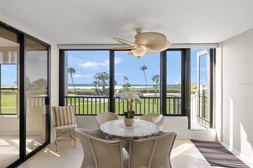 Incredible Gulf-front first-floor residence (10’ elevation) within the amenity-rich 32-acre campus of the Gulf & Bay community on Siesta Key. This 2-bedroom, 2-bath furnished condominium is ideally positioned in the highly desirable F Building and offers direct walk-out access to the beach with unobstructed views of 800 feet of private shoreline and the expansive Gulf of Mexico. Just steps from the sand, this exceptional location delivers the ultimate Gulf & Bay lifestyle—blending convenience, privacy, and breathtaking coastal scenery. This unit did not flood during recent storms. The remodeled kitchen features abundant cabinetry, a beverage cooler, and a comfortable eat-in area with a built-in desk. The primary suite captures beautiful Gulf views and includes a walk-in closet plus an additional wall closet. The en-suite bath has been tastefully remodeled with a frameless travertine shower, dual vanities, and a dedicated makeup area. The spacious guest bedroom offers two full Murphy beds, providing flexible sleeping accommodations. Additional highlights include a new A/C system (2025), 20" x 20" tile throughout the main living areas, and smooth ceilings—no popcorn. Gulf & Bay is truly one of the best resort complexes on Siesta key featuring: 2 clubhouses, 3 heated pools, pickleball courts, tennis courts (1 HarTru), well equipped fitness center, hot tub, multiple grill areas all leading out to World Famous, gorgeous Siesta Key Beach!