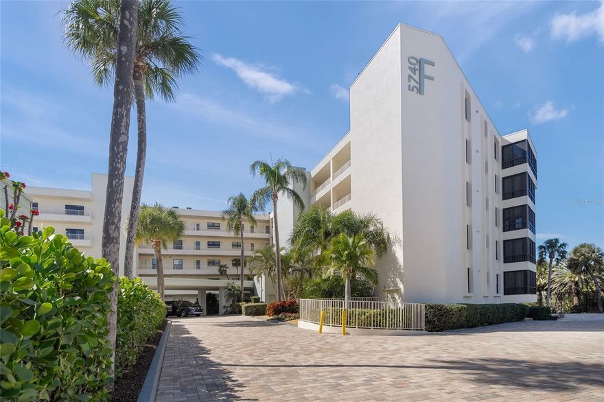 Incredible Gulf-front first-floor residence (10’ elevation) within the amenity-rich 32-acre campus of the Gulf & Bay community on Siesta Key. This 2-bedroom, 2-bath condominium is ideally positioned in the highly desirable F Building and offers direct walk-out access to the beach with unobstructed views of 800 feet of private shoreline and the expansive Gulf of Mexico. Just steps from the sand, this exceptional location delivers the ultimate Gulf & Bay lifestyle—blending convenience, privacy, and breathtaking coastal scenery. This unit did not flood during recent storms.

The remodeled kitchen features abundant cabinetry, a beverage cooler, and a comfortable eat-in area with a built-in desk. The primary suite captures beautiful Gulf views and includes a walk-in closet plus an additional wall closet. The en-suite bath has been tastefully remodeled with a frameless travertine shower, dual vanities, and a dedicated makeup area. The spacious guest bedroom offers two full Murphy beds, providing flexible sleeping accommodations.

Additional highlights include a new A/C system (2025), 20" x 20" tile throughout the main living areas, and smooth ceilings—no popcorn.