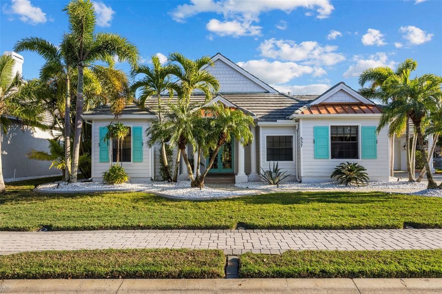 Stunning coastal inspired 5 bedroom, 4 bathroom waterfront home with boat dock, pool, spa, 3 car garage and 2 x Lanai's for Sunrise and Sunset. Freshly painted interior.  Located in the highly sought after Inlets on the Manatee River, which features tennis courts, kayak launches and a playground, this tastefully updated home has everything you need to live the perfect Florida lifestyle. 4 Bedrooms on the first floor, and an in law suite on the second floor with its own living room, bedroom, full bathroom and a balcony overlooking the water. The boat dock is on a freshwater canal connected through a lift to the salt water. The freshwater dock allows for less maintenance on your boat. This beautifully maintained home has a gas cooktop, double oven and zero corner doors leading from the breakfast dining area to the first screened patio area. A pool, spa and a large TV complete the first lanai with water views and has no other homes overlooking this oasis. The 2nd lanai is perfect for evening sunsets and grilling with private water views. The living room opens on both sides to the 2nd lanai providing a true indoor/outdoor experience. In addition to the 3280 sq ft of living space, There is over 800 sq ft of covered outdoor area with a retractable awning on the west Lanai. The oversized yard is fully fenced in and ideal for pets and children.  A full home Generac generator was installed in 2023. There is a new footpath connecting both lanai's on the outside of the home. The Inlets is a friendly riverfront community that is meticulously landscaped throughout with mature palm trees. To top this all off, the community has a LOW HOA and NO CDD This is a true gem. Some photos are virtually staged.