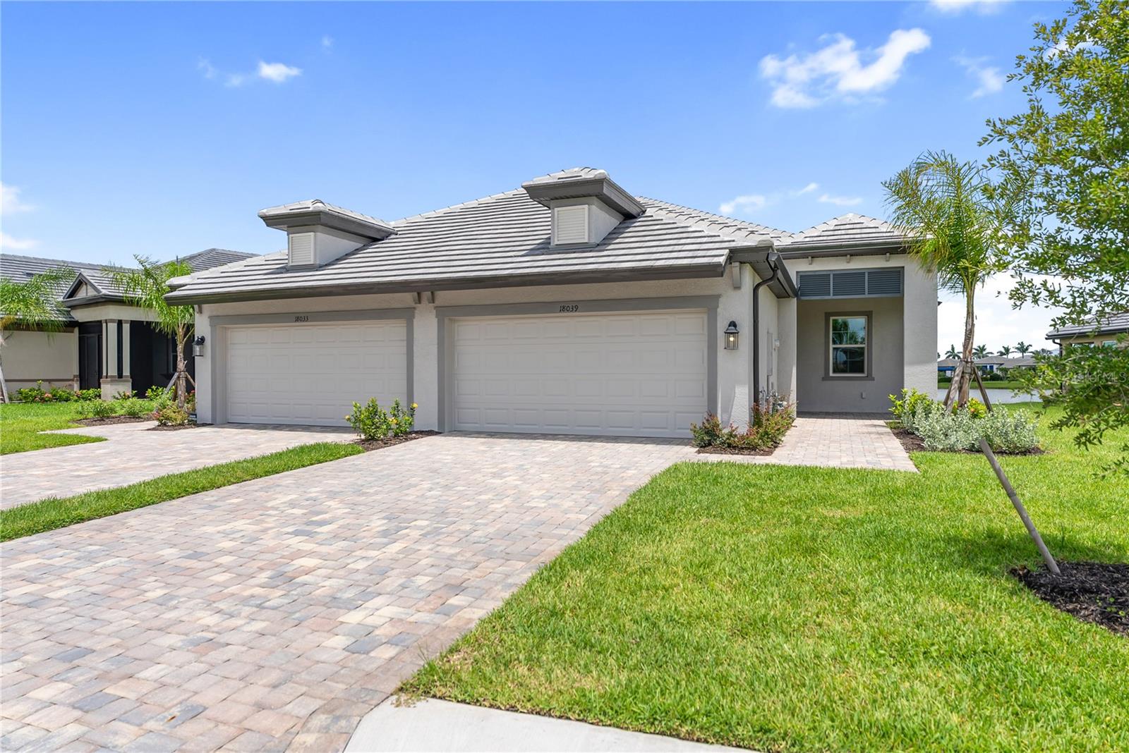 One or more photo(s) has been virtually staged. Get ready for your dream home at Sweetwater Villas at Lakewood Ranch! This villa is all about comfort, luxury, and practicality with its well-planned layout. As you step in through the extended entryway, imagine yourself starting each day savoring your morning coffee as you prepare to take on the day.
The heart of this lovely abode features a cozy den perfect for relaxation or work, which has doors for maximum privacy. The kitchen is a delight with its large center island, beautiful cabinetry, ample counter space, and a pantry to ensure sufficient storage.
Next, you'll find the dining area followed by the spacious great room that boasts sliding glass doors on the back wall. These doors open up to an enchanting covered lanai, providing you with endless opportunities for entertaining or simply enjoying the outdoors.
The luxurious owner's suite is located in a separate wing of the house, offering privacy and relaxation. The bedroom seamlessly connects to the bathroom that comes equipped with dual vanities, a walk-in shower, and a roomy walk-in closet.
At the front lies another bedroom and a complete bathroom for your convenience. Just beside this is the utility room, allowing easy accessibility to other parts of the house.
With its two bedrooms, two bathrooms, den, and two-car garage, the Topaz offers both style and functionality in one magnificent package!