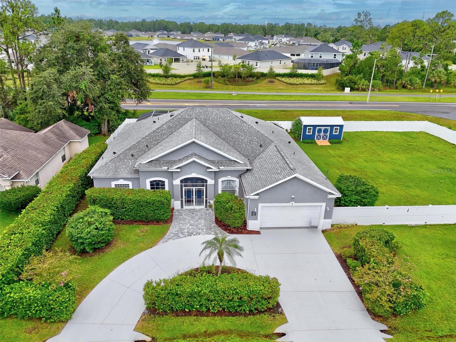 Welcome to 4 Westmoreland Drive, a stunning and well-maintained 4-bedroom, 3-bathroom pool home located on an oversized corner lot spanning more than half an acre. This property is packed with upgrades and thoughtful features that make it truly move-in ready. The split floor plan offers both privacy and functionality, with an open layout that includes a formal dining room, two separate living spaces, and a spacious kitchen with island seating and ample cabinetry. One of the full bathrooms leads directly out to the screened, solar-heated saltwater pool, making it perfect for entertaining and everyday Florida living. The covered lanai offers a peaceful spot to relax and enjoy the outdoors year-round. The oversized backyard is fully fenced and features mature landscaping, a circular driveway, and a 10x20 storage shed that’s less than a year old. Inside, you'll find no carpet, a smart home system with camera connectivity, a new water heater, a water softener system, and a UV air purification setup for improved air quality. The oversized garage includes built-in overhead storage and houses the laundry area, complete with modern washer and dryer units and utility sink. The primary suite includes his-and-her closets, a walk-in shower, double vanities, and a soaking tub for added comfort. This home is also being offered furnished, if desired, and the seller is motivated. Don't miss the opportunity to own a thoughtfully upgraded, spacious home in a desirable Palm Coast location.