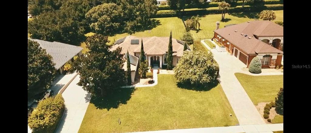 Photo of 16325 Magnolia Bluff Drive, Montverde, FL 34756 (MLS # TB8495073)