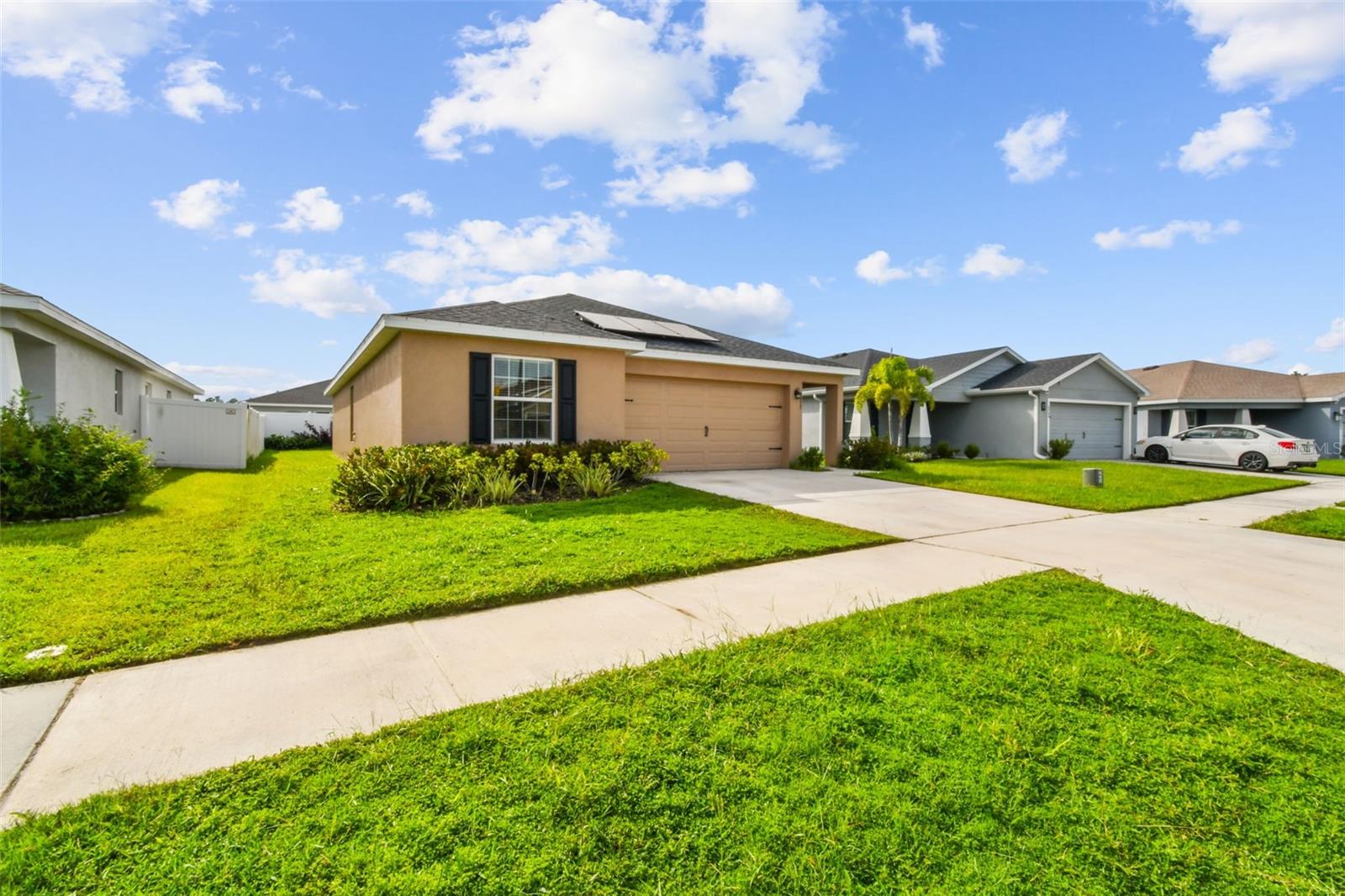 Looking for a newer community with great amenities? This 4-bedroom, 2-bath home built in 2021 offers the perfect blend of comfort, convenience, and style. The open-concept floor plan boasts a modern kitchen, dining area, and living room that flow seamlessly together—ideal for both everyday living and entertaining. The private primary suite provides a peaceful retreat, while three additional bedrooms offer flexibility for family, guests, or a home office.
Step outside through the dining room sliders to a mostly fenced backyard, perfect for gatherings or quiet relaxation. Community amenities include a pool, playground, and dog park, giving you and your family plenty of ways to enjoy the Florida lifestyle. This home also features solar panels—buyers may assume the payment schedule with approval, making this home both energy-efficient and cost-conscious.
Conveniently located near the SR54 corridor, you’ll enjoy quick access to shopping, dining, and business hubs, all while being surrounded by scenic countryside.