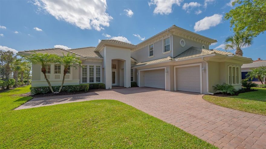 This stunning 4 bedroom, 4.5 bath two story home in The Founders Club offers all the room and style necessary for you and your loved ones to live an incredible Florida lifestyle.  The large pavered driveway leads to this picture-perfect home, with double, leaded glass front doors. Step inside and your first impression will be one of delight.  Light from the transom window makes for a cheery welcome. The living room has a decorative ceiling, fireplace surrounded by built-in shelves to display all your cherished collectables, and an aquarium window look out over the pool to the golf course beyond.   The breakfast nook has a similar window and view. It adjoins the den and open kitchen with dual sinks, stainless steel appliances, a five burner gas cooktop, a small center island and a chef’s desk. The master bedroom has three large windows to bring in the sunshine, and a door leading to the lanai.  The master room has a tub, separate walk-in-shower, and a built-in vanity. The other bedrooms are all spacious.  Besides the 4.5 bathrooms, there is a first floor office space as well as an upstairs entertainment room. Outside you will find the lovely lanai, featuring an outdoor kitchen. This area has plenty of covered space with ceiling fans for dining, or just relaxing, in the shade on a sunny afternoon, as well as uncovered areas to soak in the rays if that is your preference.  The pool is beautifully designed with a custom spa.  From every part of the lanai, you are treated with gorgeous views of the golf course, and the lake in the distance. The Founders Club, a gated community set among 700 acres of natural landscape has an award-winning Robert Trent Jr. designed golf course, a beautifully designed clubhouse, a fitness center, Har-Tru tennis courts, basketball courts, sand volleyball courts and miles of walking trails, all within minutes of everything downtown Sarasota, and the surrounding area, has to offer.