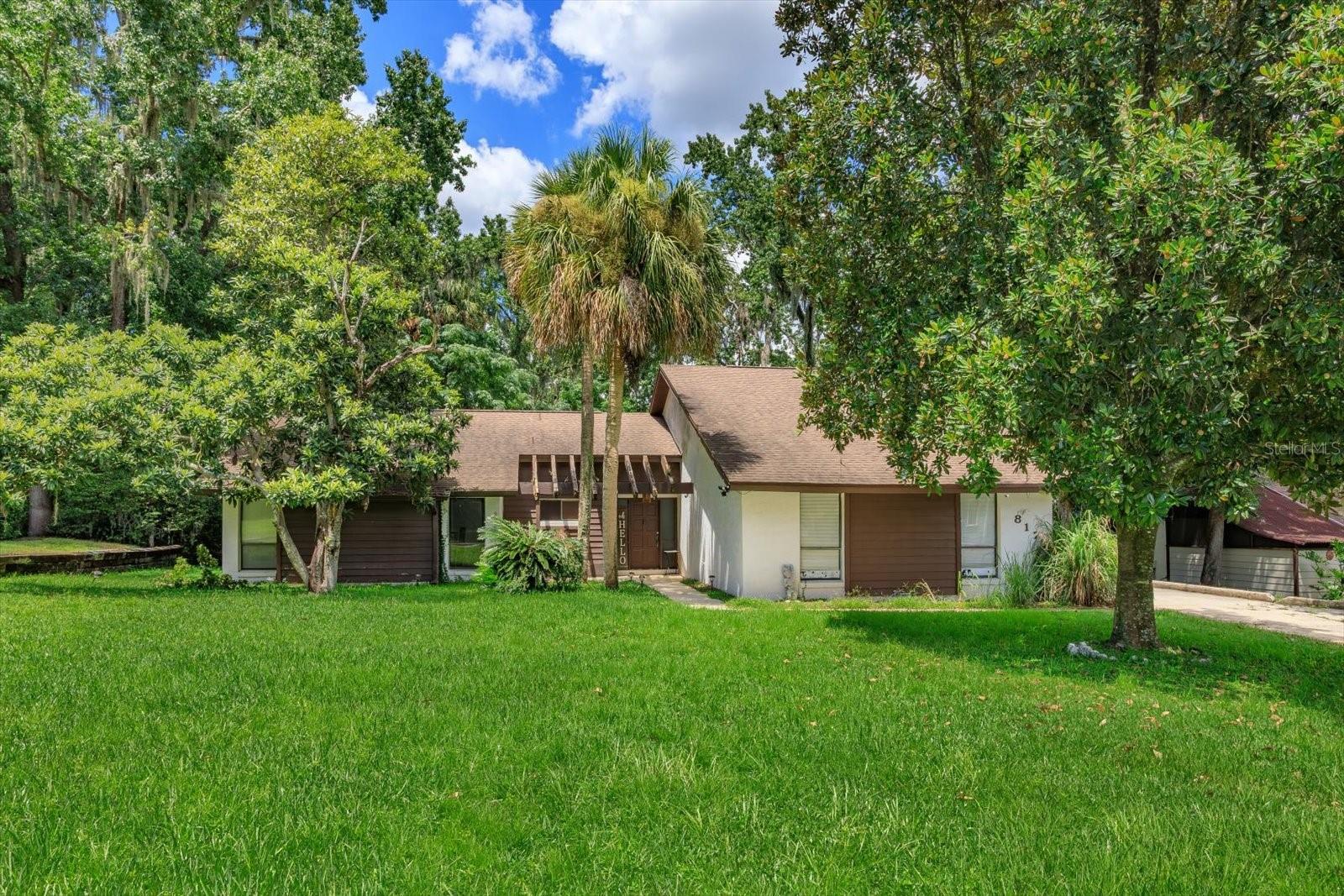 Welcome to this inviting 3-bedroom, 2-bathroom home nestled in the sought-after Wekiwa Glen community in Apopka, Florida. Surrounded by lush, mature landscaping and majestic trees, this property offers a serene and private setting just minutes from parks, shops, and top-rated schools.
Inside, you’ll find an open and airy floorplan highlighted by vaulted ceilings and abundant natural light. The spacious living area features a cozy wood-burning fireplace, perfect for relaxing evenings or entertaining guests. The layout flows seamlessly into the dining and kitchen areas, creating a welcoming space for everyday living.
Additional features include a long driveway offering plenty of parking and excellent curb appeal, and a backyard shaded by mature trees — ideal for outdoor gatherings or quiet afternoons.
Don’t miss your chance to own this inviting home in one of Apopka’s most established and scenic neighborhoods!