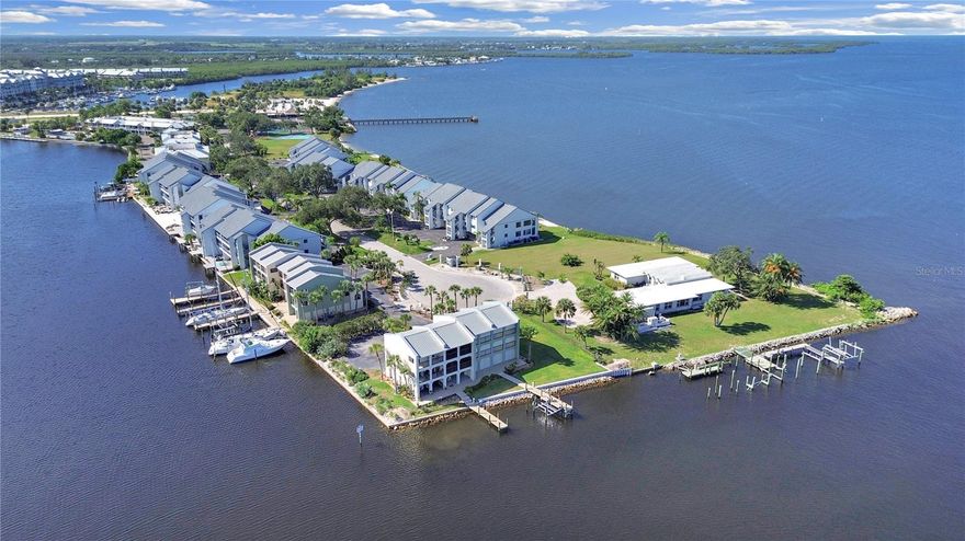 Calling ALL BOATERS!  Rarely available condominium with Deeded Deep Water Boat Slip can now be yours!  Discover the ultimate luxury coastal living with this beautifully updated and lovingly maintained 2-bedroom, 2-bath residence on the shores of Tampa Bay.  Inside the home features a bright coastal aesthetic and a host of modern upgrades.  The kitchen offers granite countertops, stainless steel appliances and beautifully designed wood cabinets with glass panels.  The open floor plan features wood floors and crown molding throughout the living area and breathtaking views of the wide water canal.  The spacious terrace extends this living area outdoors, creating an ideal setting for morning coffee, evening meals, and year round entertaining. It is the perfect location for viewing dolphin sightings and watching the boats coming to and from Tampa Bay.  The primary suite on the second floor serves as a peaceful sanctuary with its dedicated spacious terrace to once more enjoy the beauty of waterfront living as it beckons relaxation with its soothing hot tub.  The second guest bedroom faces West, offering spectacular sunsets.  The outdoor living and entertaining experience continues at the carport entry level, offering parking for 2 vehicles and featuring a spacious lanai with pavers, along with a bonus storage room.  With only 9 residences in the seaside community of Bahia del Sol, this unique and exclusive waterfront location offers a resort style living like no other.  Escape to Paradise where the Beach meets the Boat!  Within walking distance is a 1/2 mile white sand beach, 2 waterfront restaurants with sports/Tiki Bar/patio dining and entertainment, watersports rentals, and fishing charter availability. Don’t miss your chance to own a piece of paradise with your boat located just steps outside your back door.  Call today to schedule an appointment and experience paradise each and every day.