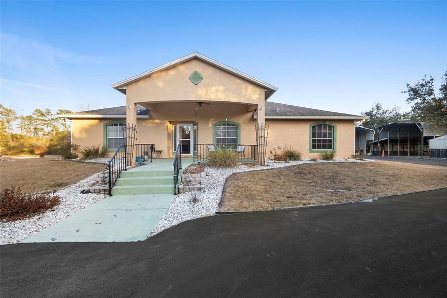 Welcome to your private Florida retreat! Nestled on 5 gorgeous acres zoned for horses in desirable Royal Trails Unit 2, this stunning 3-bedroom, 2-bath pool home offers 1,852 sq ft of peaceful living with no neighbors in sight and a truly breathtaking setting. Built in 2004, this property features a private paved drive and a beautiful circular driveway leading to a welcoming front porch and impressive entrance.

Step inside to an open, split-bedroom floor plan featuring a spacious 23x18 great room with soaring ceilings, plant shelves, and a striking stone electric fireplace. The home showcases beautiful hand-scraped laminate flooring throughout—NO carpet! The kitchen is perfect for entertaining with a massive 9.5 ft breakfast bar, stainless steel appliances, reverse osmosis system, and an open view to the living area.

The primary suite is a true escape, offering walk-in closets, double vanities, a jacuzzi tub, and private access to the pool area.

Enjoy the ultimate outdoor lifestyle with a 15x30 in-ground gunite saltwater pool, solar heated, (solar panels are paid off) , with a full 32x38 screen enclosure, waterfall feature, and plenty of space to relax and entertain. The backyard also includes a fire pit and endless room to enjoy wildlife, peace, and quiet.

Additional features include a 2-car side-entry garage, two large RV carports, two outbuildings, inside utility room, washer & dryer included, and water softener included.

Major updates include: Roof 2020, HVAC 2015, hot water heater 2015, and septic cleanout 2017. Seller to give credit towards closing costs assistance in lieu of paint allowance with acceptable terms. 

Located just minutes from Historic Downtown DeLand, only 4 miles to the St. Johns River, and surrounded by nature—this is the perfect place to enjoy privacy, space, and the Florida lifestyle you’ve been dreaming of! Located in the USDA map eligible. Sits on a high and dry lot. No flooding issues. Call today before this Home says "SOLD"