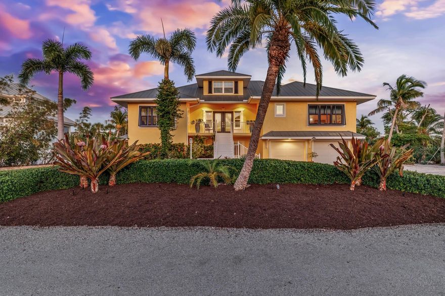 The Ultimate Tropical Paradise on the North Shore of Boca Grande.  Welcome to your own slice of heaven where lush landscapes and turquoise waters meet luxury and tranquility.  This magnificent 4 bedroom 4 bath property features a stunning main house with an attached two-bedroom two bath guest suite, making it the ultimate tropical oasis for you and your guests. Enjoy the open concept kitchen with high-end appliances, granite countertops and custom cabinetry.  Luxurious master suite, saltwater tropical pool, oversized garage, block construction, and hurricane impact windows.  Beach easement access, a private path leads directly to the secluded and pristine North Boca Grande beach to find the best shelling on the island.