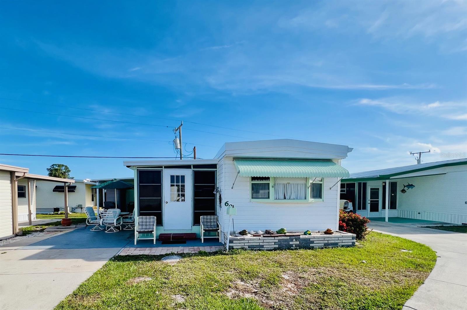 Discover the Florida lifestyle in the vibrant Brook to Bay 55+ community! Amenities include a community pool, bocce ball, shuffleboard, a clubhouse, picnic area, boat slips (1st come), and a boat ramp. This charming, manufactured home features 2 bedrooms, 2 baths, a bright and roomy kitchen, and an inside laundry area with full-size washer/dryer. The primary bedroom includes a spacious walk-in closet. The home comes turnkey furnished, providing convenience and value. The attached utility room includes a small workbench and plenty of room for storing your bike, fishing gear, and golf clubs—everything you need to dive into the laid-back Florida lifestyle. Roof was recently replaced in 2025. Brook to Bay is located just minutes from Englewood’s beaches and offers a great location at an affordable price. Don’t miss this incredible opportunity—call today to make this slice of paradise your own.