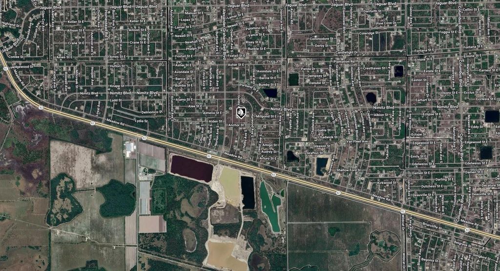 Photo of 1039 Gunby Avenue S, Lehigh Acres, FL 33974 (MLS # A4671152)