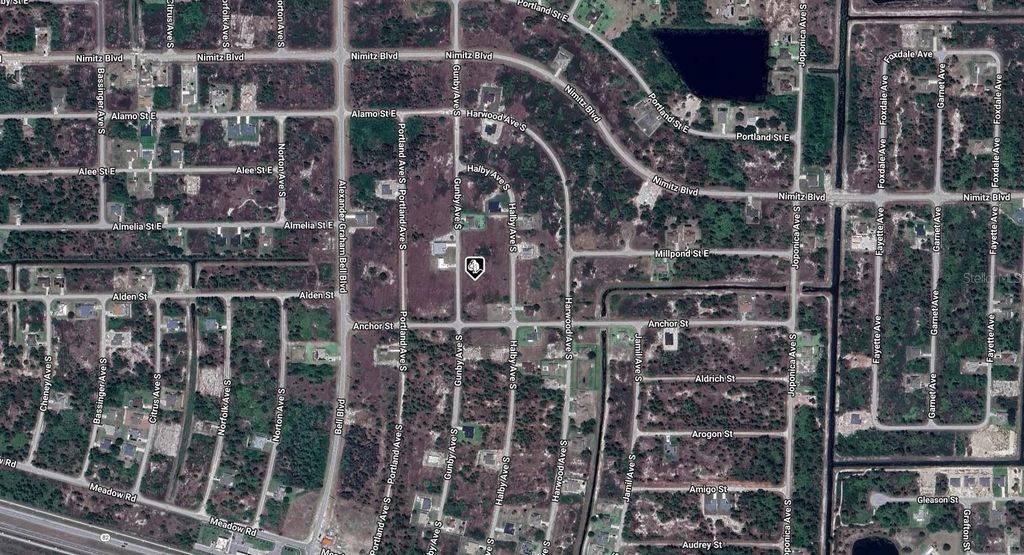 Photo of 1039 Gunby Avenue S, Lehigh Acres, FL 33974 (MLS # A4671152)