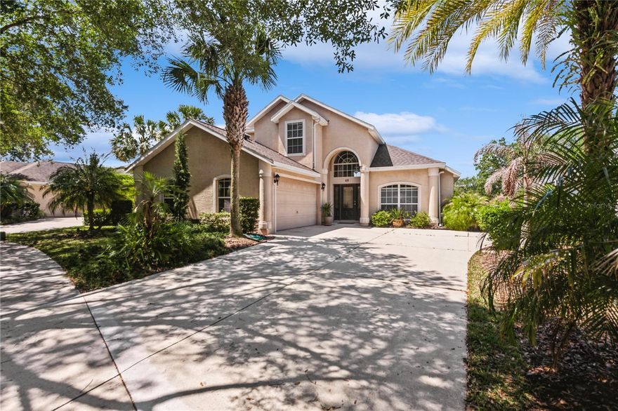 Location,Location!!!69 Southlake Drive is a lovely 3 bedroom plus loft/2.5 bath home located in Palm Coast on one of Grand Havens ponds.There are great water views from the kitchen, 40 foot porch, master bedroom and the loft area. There is a formal dining room,updated  kitchen with breakfast nook,wooden cabinets, solid surface counter tops and stainless steel appliances. The master bedroom is  on the first floor and master bath has walk in shower, garden tub and double vanities.There is also a half bath on the first floor.The second floor has 2 guest bedrooms and a full bath and loft. The roof and AC have been replaced in 2021. 69 is a move in ready house in a great community! Fees include 2 pools, pickle ball, tennis, bocce,cafe, exercise classes, water aerobics. There is also a Jack Nicklaus golf course in the community for separate fee.