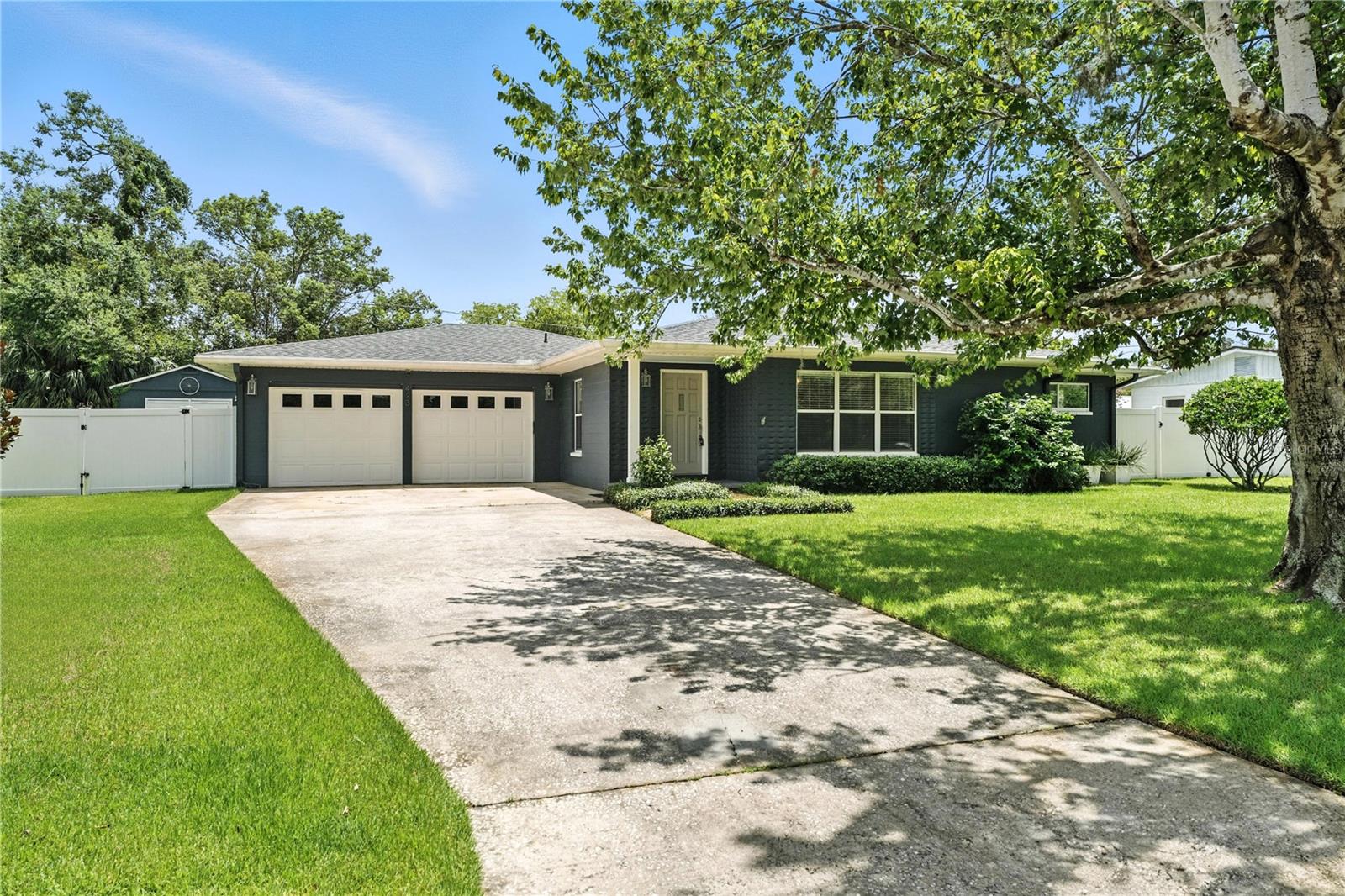 Mid-Century Charm Meets Modern Comfort in Winter Garden!
Discover the perfect blend of classic appeal and contemporary upgrades in this delightful 3-bedroom, 2-bath pool home, ideally situated on a generous .30+ acre lot just blocks from downtown Winter Garden. Best of all, there's no HOA!
Step inside and appreciate the thoughtful updates that complement the home's timeless mid-century architecture. The kitchen boasts updated Bosch appliances, including a 2021 induction range and 2023 wall oven for a total of two ovens, along with quartz countertops and an updated farm sink. You'll find engineered hardwood floors in the family room, kitchen, and hallway, and custom window blinds throughout. Peace of mind comes with a brand-new roof (July 2025), rain gutters, an AC unit replaced in 2019, and a gas hot water heater from 2018.
The primary bedroom suite offers three deep closets with custom doors and a renovated en-suite bath (2021) featuring new tile, a walk-in low threshold shower, and modern fixtures that maintain the home's classic character. The hall bath was also renovated in 2023 with new tile and paint. The dining room provides a cozy ambiance with a gas fireplace and built-in shelves, while French doors open to a spacious 26x17 covered and screened back porch wired with Bluetooth speakers and also has a 220 power hookup for a hot tub. A versatile mud room/art studio/office and a dedicated laundry room add to the home's functionality.
The outdoor living space is a true oasis, featuring a fenced backyard (2019) with an amazing heated saltwater pool (2019), complete with a sun ledge. The yard is kept lush with an irrigation system fed by a well (pump replaced 2020) and a French drain system (2019) for optimal drainage. The north gate is a double gate, allowing boat or RV parking behind the fence, with an RV electric outlet on the side of the house. Plus, there's a large elevated workshop building with electricity and AC for your projects (As Is). In 2023, a variance was obtained through the City of Winter Garden to build a new structure where the current workshop sits, which also allows for an attached covered veranda to be built.
Beyond your doorstep, the vibrant heart of Winter Garden awaits. This home is located in the golf cart district, allowing you to drive your own golf cart on approved roads. Enjoy leisurely strolls to the weekend farmers market, participate in festive holiday events, and explore a diverse array of restaurants and shops. You're also within walking distance to Lake Apopka, where breathtaking sunsets are a daily spectacle, and it's renowned as one of Florida's top three birding areas. The Jessie Brock Community Center (offering exercise and Crealde art classes) and its pond with a paved walking circuit and exercise stations are also just a short walk away, as is the West Orange Bike Trail.
This Winter Garden gem offers not just a home, but a lifestyle. Don't miss your chance to own a piece of this charming and convenient community!