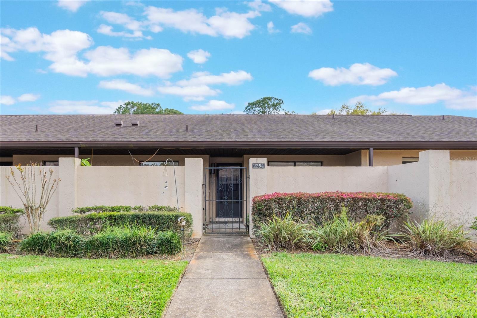 Welcome home to this spacious 2-bedroom/2-bathroom Golf Villa located in the highly-sought-after Cypresswood Golf and Country Club community of Winter Haven. This SINGLE STORY villa offers TWO outdoor spaces in both the front and the rear, covered parking (golf carts allowed, too!), a huge heated/cooled lanai overlooking the 8th fairway, and your very own WET BAR in the living room! The Cypresswood community features an 18-hole championship golf course designed by Ron Garl, junior Olympic-sized community pool, lighted tennis courts, clubhouse, event space, and so much more. Pool and tennis amenities, pest control, maintenance repairs, and professional management are included with your lease. Cypresswood also offers a clubhouse with restaurant and pro-shop--the perfect place to meet with friends or host a special event. This home is minutes from Highway 27 and the I-4 corridor, Winter Haven's very own Legoland Florida Resort, the Polk Parkway, and in the center of a thriving community with many convenient grocery, restaurant, shopping, and commuting options. Up to three pets allowed with prior approval; applications approved based on creditworthiness and income equal to at least 3x monthly rent, otherwise additional security deposit may be required.