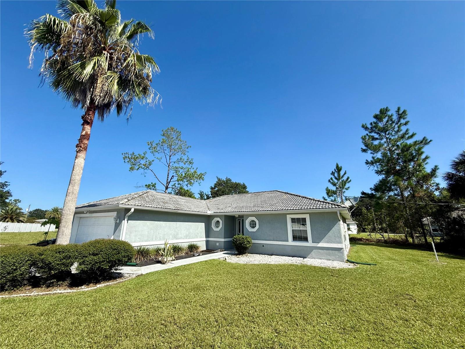 Amazing Flag Lot with HUGE fenced in back yard & animals permitted! 3 bedroom, 2 bathroom with fresh interior paint, laundry room with washer and dryer plus screened in back patio. Non Refundable Pet Fee & Monthly Pet Rent To Be Determined By Third Party Screening.