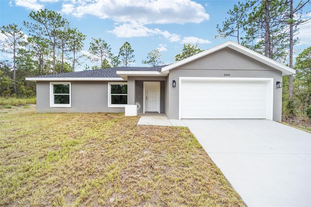 Photo of 24144 NW Water Oak Avenue, Dunnellon, FL 34431 (MLS # OM715931)