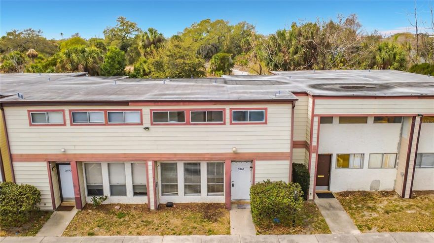 One or more photo(s) has been virtually staged. This spacious 2-story townhome features a smart floor plan with a large open-concept living and dining area, a convenient half-bath downstairs for guests, and two oversized bedrooms upstairs, each with its own private full bathroom. Enjoy morning coffee on your private balcony or relax in the fenced courtyard. The Village community amenities include a pool, tennis courts, and even a boat dock with access to Lake Catherine. Perfectly situated near the Mall at Millenia, Orlando International Airport, and major highways (I-4, Turnpike, 408) for an easy commute. Water and sewer are included in the monthly dues!