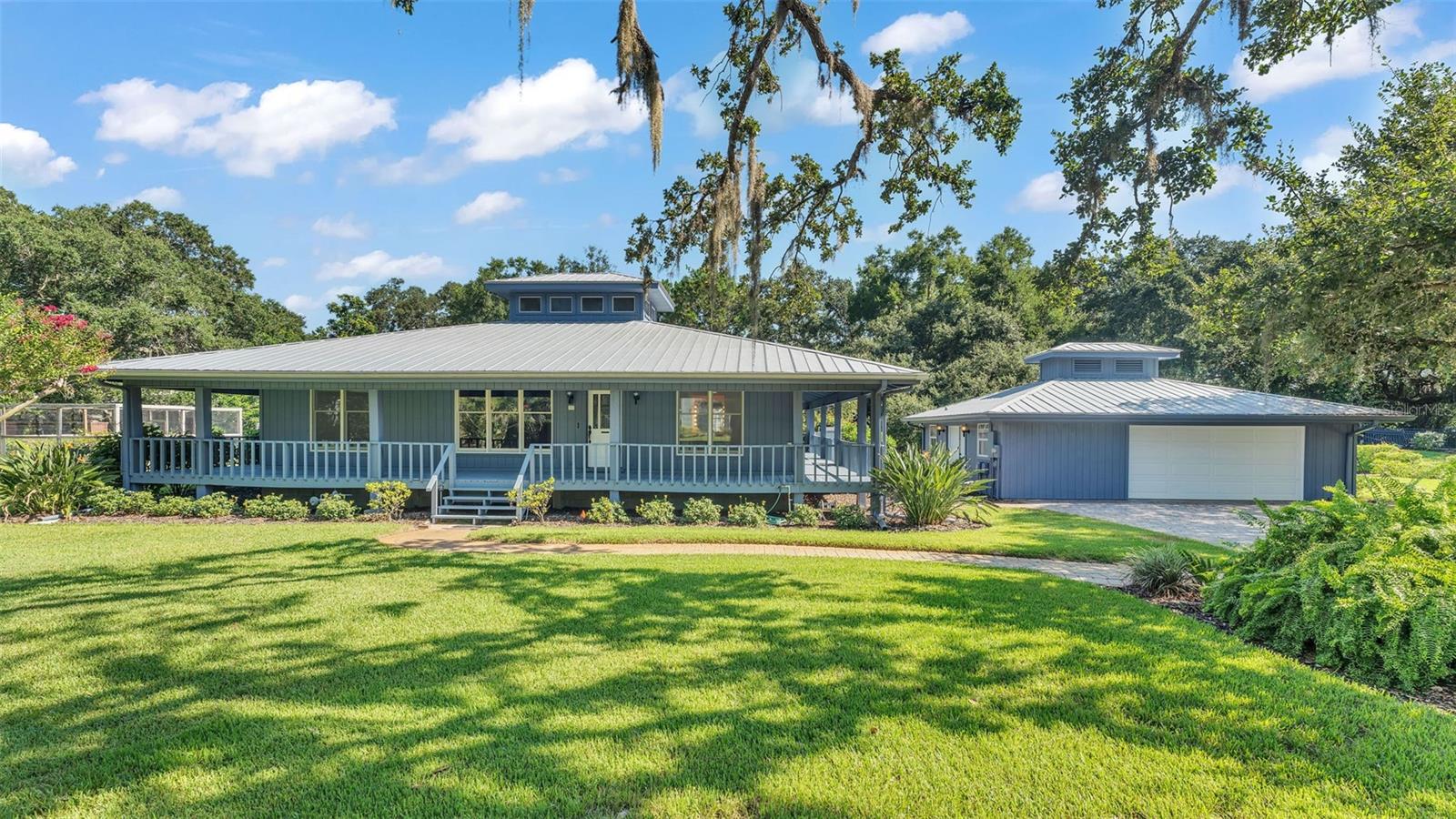 Charming & Unique Florida Cracker-Style Home on Nearly an Acre!
Welcome to this one-of-a-kind 3-bedroom, 2-bath Florida “cracker” home, nestled on a beautifully landscaped .96-acre lot in a quiet, private cul-de-sac. Brimming with character, this home offers timeless style, comfort, and the peaceful charm of Old Florida living.
Step inside to discover gorgeous wood floors throughout, a warm and inviting layout, and a tastefully appointed kitchen featuring modern finishes that blend seamlessly with the home's classic design—perfect for both everyday living and entertaining.
Outside, relax and unwind on your spacious wraparound porch, ideal for enjoying morning coffee or evening breezes. The grounds are a gardener’s dream, with beautiful landscaping, blueberry bushes, a fruit-bearing avocado tree, plus pineapples and rosemary flourishing right in your own backyard.
A detached 2-car garage provides ample parking and includes additional space for a workshop or extra storage—perfect for hobbies, tools, or outdoor gear.
This home is a true retreat, offering privacy, personality, and a deep connection to Florida’s natural beauty. Don’t miss this rare opportunity—schedule your private showing today!