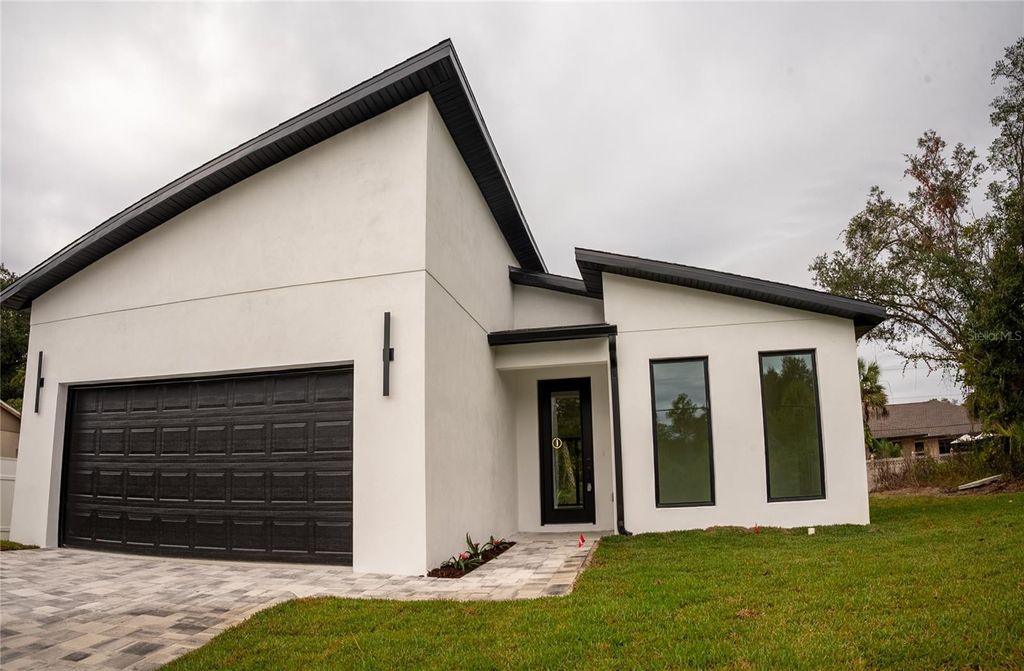 Photo of 301 Eppinger Drive, Port Charlotte, FL 33953 (MLS # O6370967)