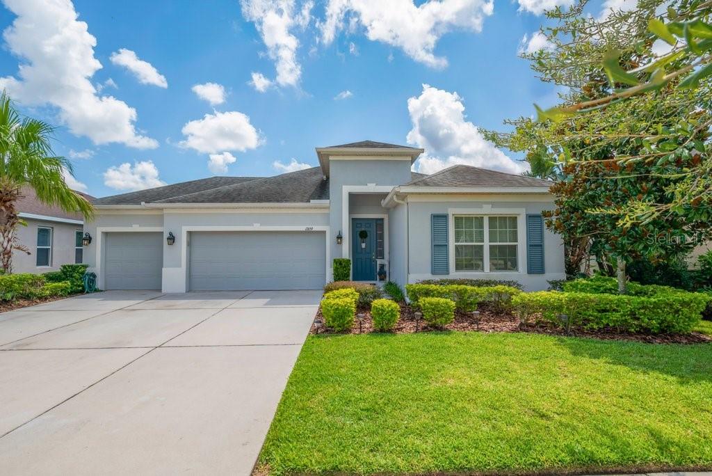 Congratulations, Your Search is Over! Nestled in a highly sought-after community with NO CDD fees, low HOA, Top Rated Schools and Resort-Style Amenities. Boasting 2395sqft of living space, this beautiful Taylor Morrison Antigua model offers a perfect blend of comfort, privacy, and everyday luxury. Situated on a lot, enjoy peaceful views and no rear neighbors—your own private retreat awaits. Step inside to a fabulously designed home featuring, wood look tile floors, 4 spacious bedrooms, 3 full bathrooms, and a versatile split floor plan ideal for multi-generational living or guest privacy. An abundance of natural light fills this open-concept layout. This wonderful one story plan offers a flex space, perfect for a home office, gym, or playroom. The heart of the home is the fabulous kitchen, complete with Quartz countertops, stainless steel appliances, a large island, pendant lighting, and a plethora of cabinets. A generous walk-in pantry provides ample storage, while the adjacent great room and dining area open to serene backyard views. The primary suite at the rear of the home, with picturesque views, a spa-like en-suite bath with a garden tub, frameless glass shower, and quartz vanitiy. Two additional bedrooms share a full bath, while a fourth bedroom located at the front of the home —ideal for in-laws or guests—enjoys its own private bath at the front of the home. Step outside to the covered lanai and expansive backyard, ideal for outdoor dining, entertaining, or simply enjoying the tranquil conservation setting. As a resident of Channing Park, you'll have access to world-class amenities, including ** TOP RATED FISHHAWK SCHOOLS, Basketball Court, Two Dog Parks, Soccer Field, Playground, Two Pools + Splash Pad, Fitness Center, Grilling Stations, Skate Park, Walking Trails, Clubhouse. This home is ready and waiting for you. Don't miss your chance to be part of one of the area’s most vibrant and welcoming communities—schedule your showing today!