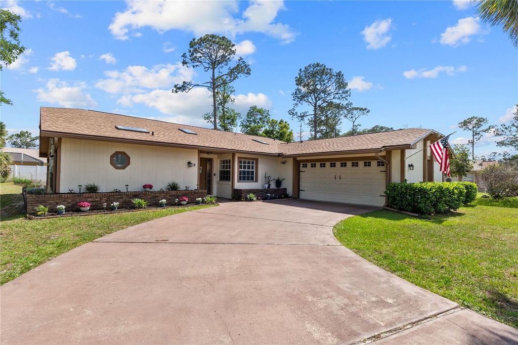 Photo of 28 Westbriar Lane, Palm Coast, FL 32164 (MLS # FC318151)