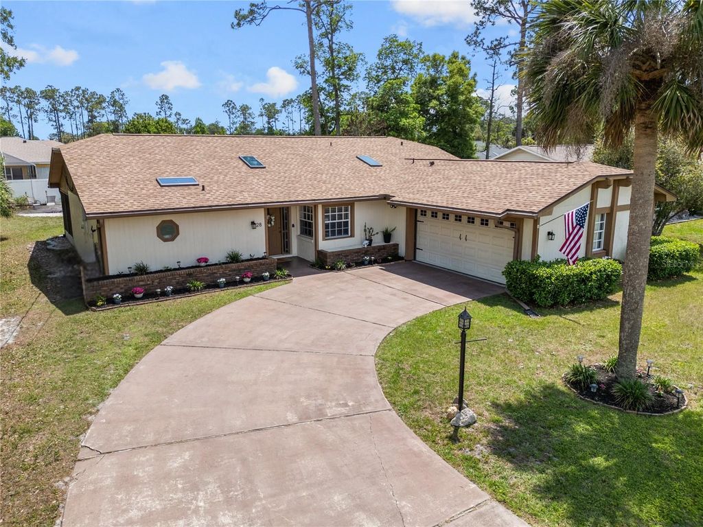 Photo of 28 Westbriar Lane, Palm Coast, FL 32164 (MLS # FC318151)