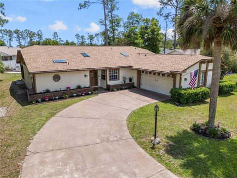 Photo of 28 Westbriar Lane, Palm Coast, FL 32164 (MLS # FC318151)